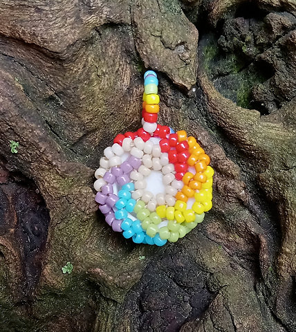 Brown eye rainbow beaded pendant