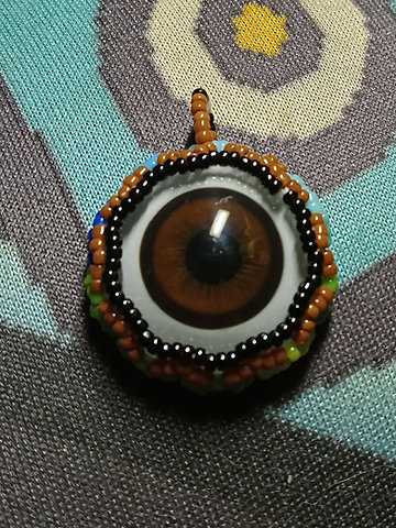 Peyote stitched brown glass taxidermy eye