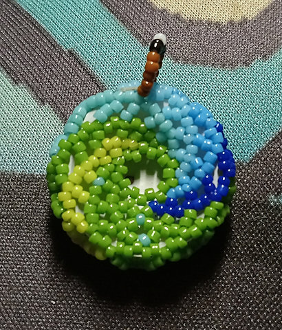 Peyote stitched brown glass taxidermy eye