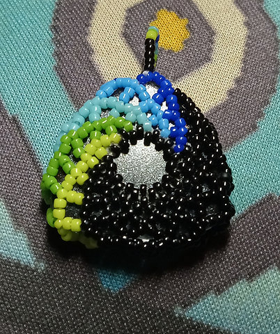 Color shifty beaded triangle pendant