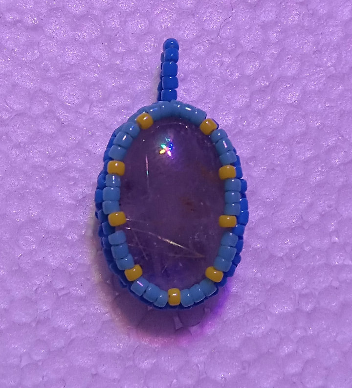 Beaded rutilated quartz pendant