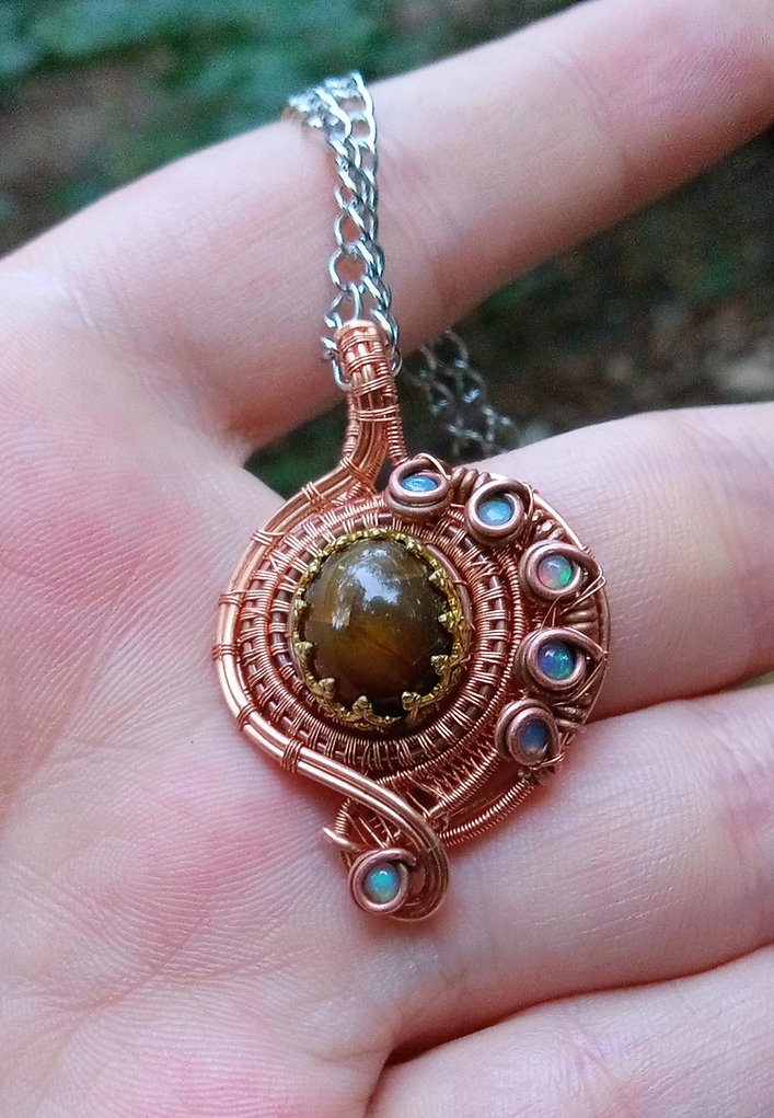 Ethiopian opals wrapped in copper and some brass pendant