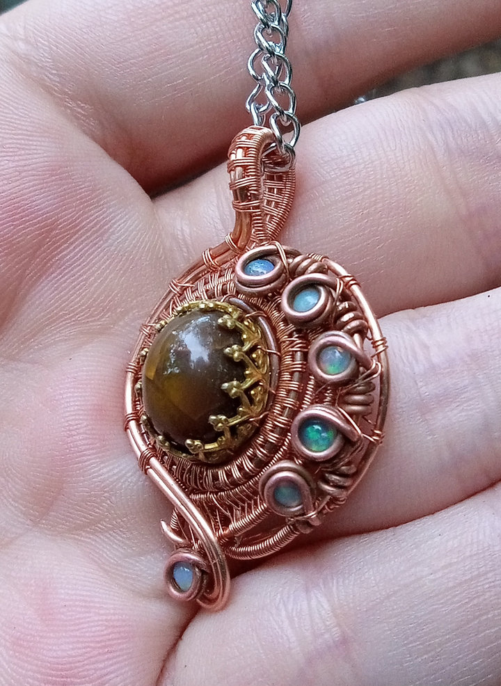 Ethiopian opals wrapped in copper and some brass pendant