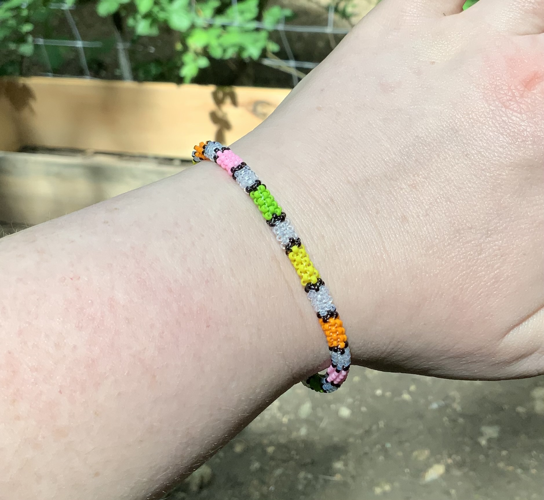 Pastel partial rainbow and clear beaded bracelet 
