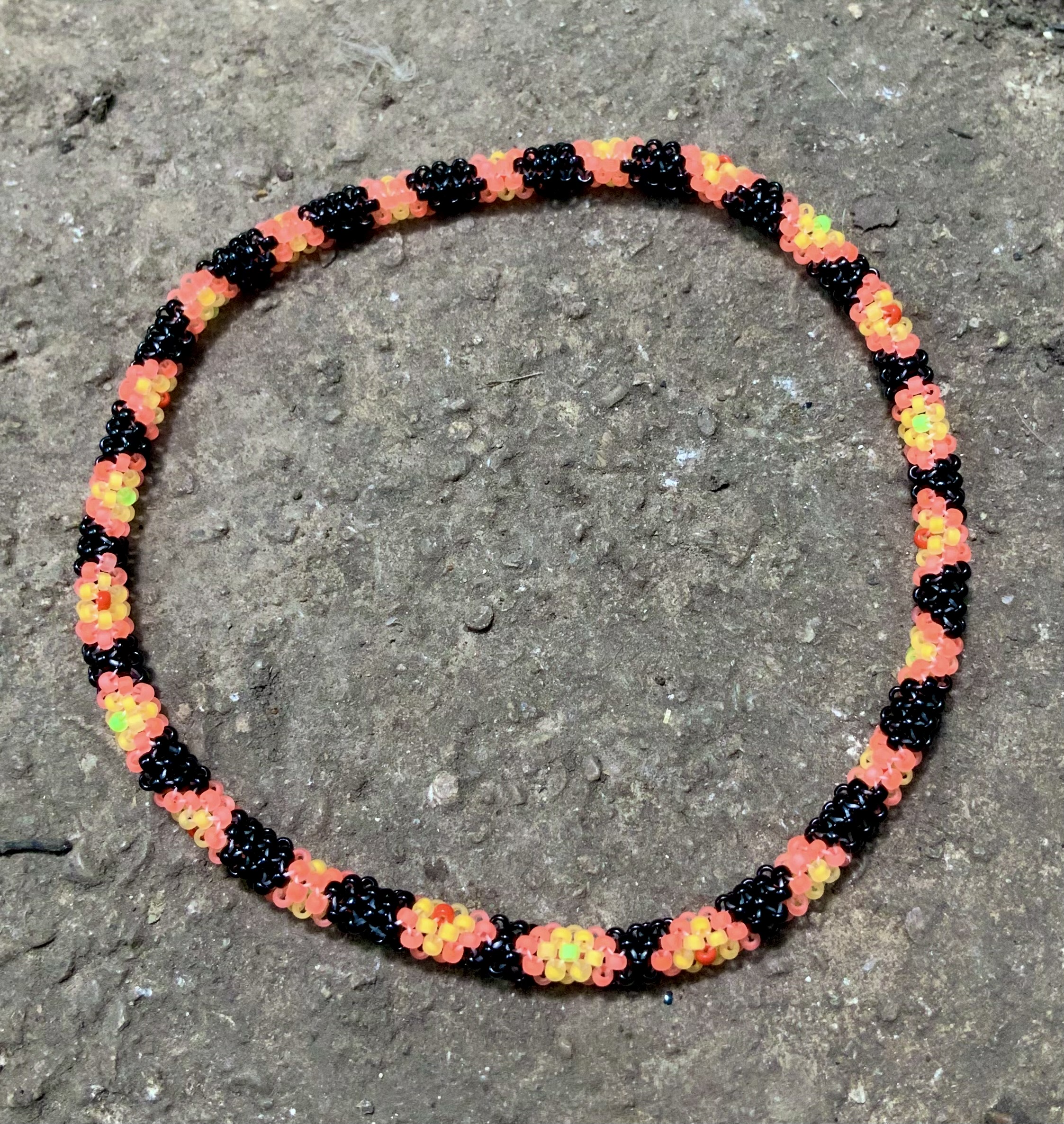 Custom orange and black snake beaded bracelet 