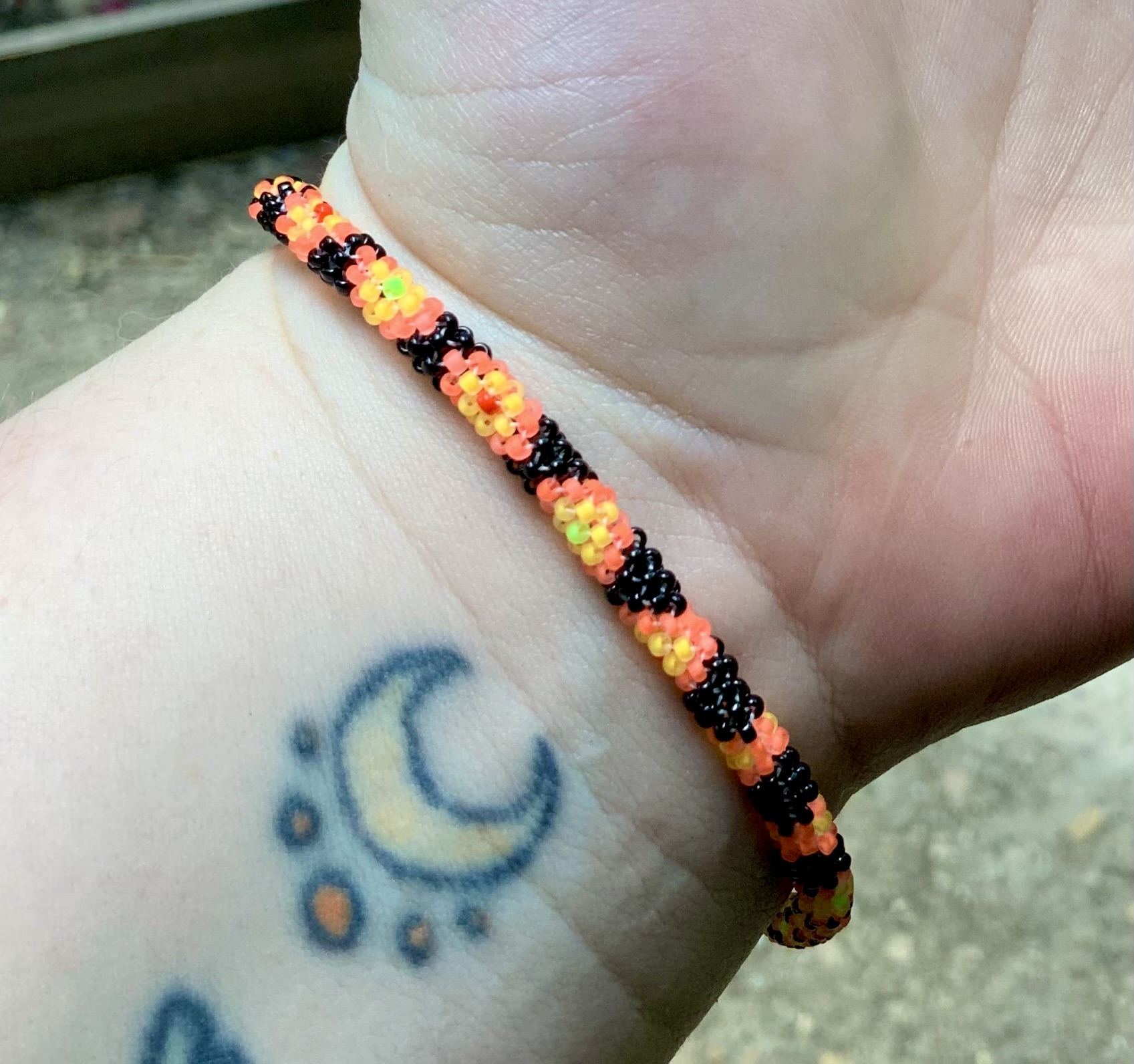 Custom orange and black snake beaded bracelet 