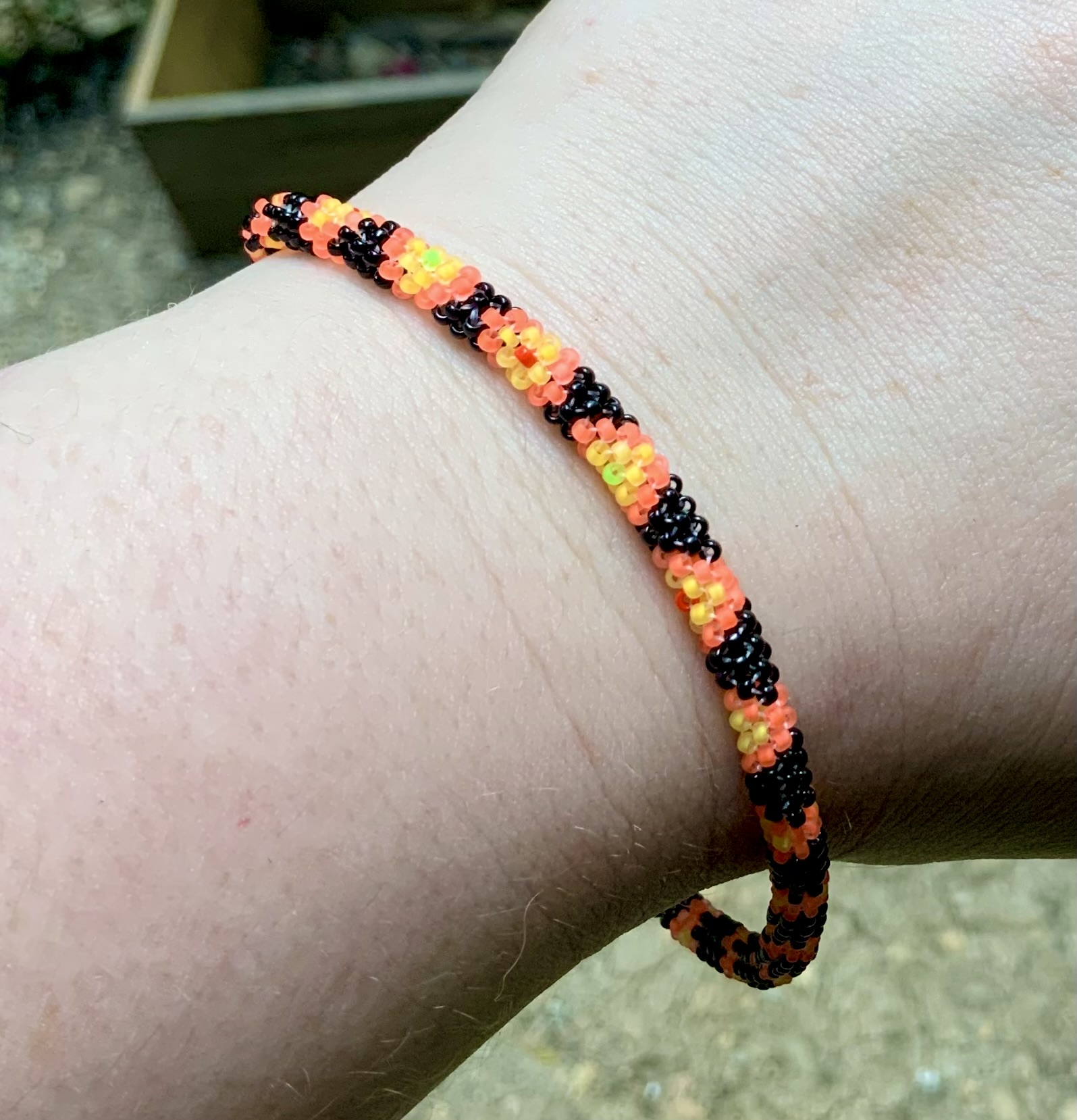 Custom orange and black snake beaded bracelet 