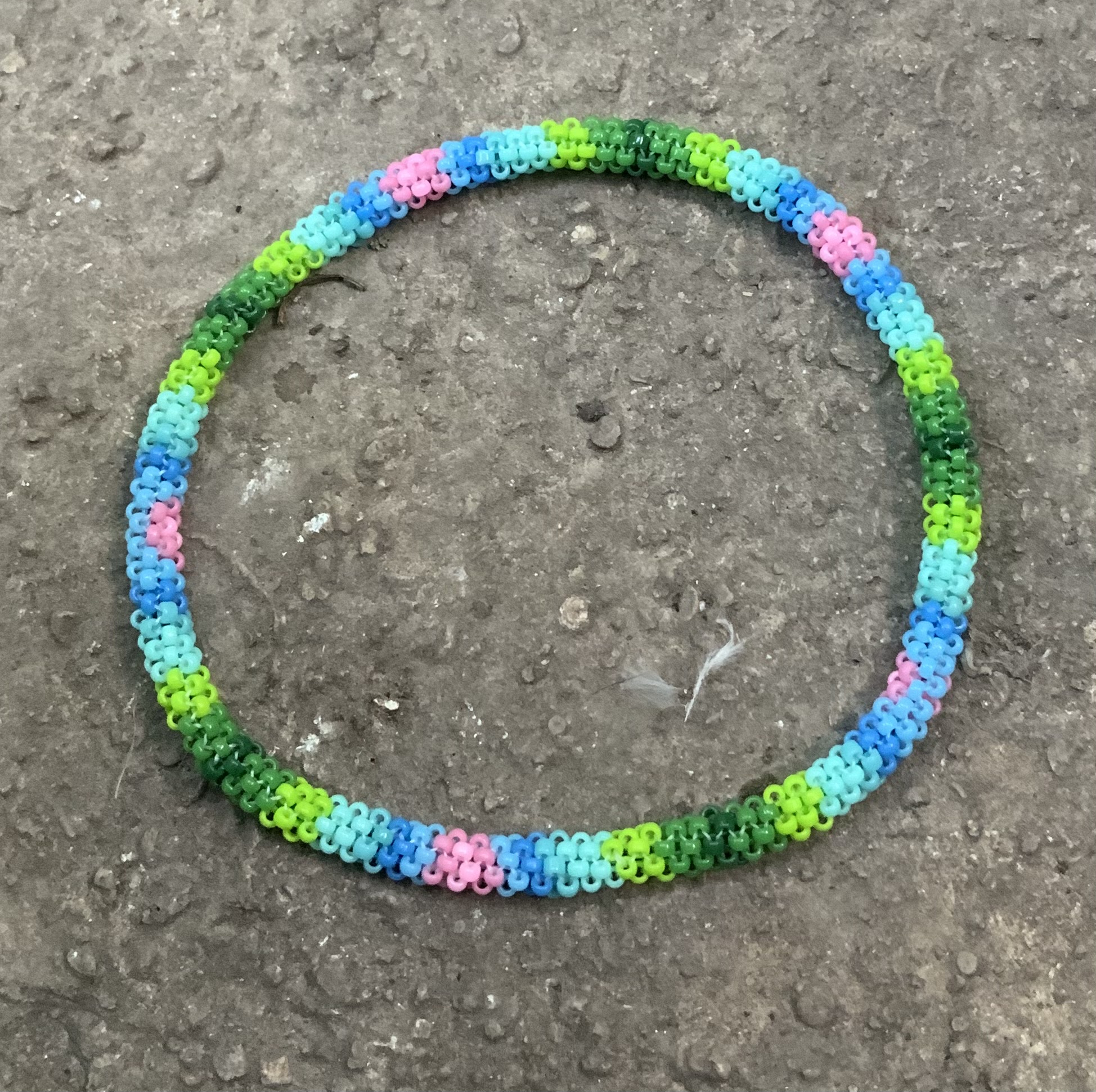 Hearts in the sky by a grassy knoll beaded bracelet