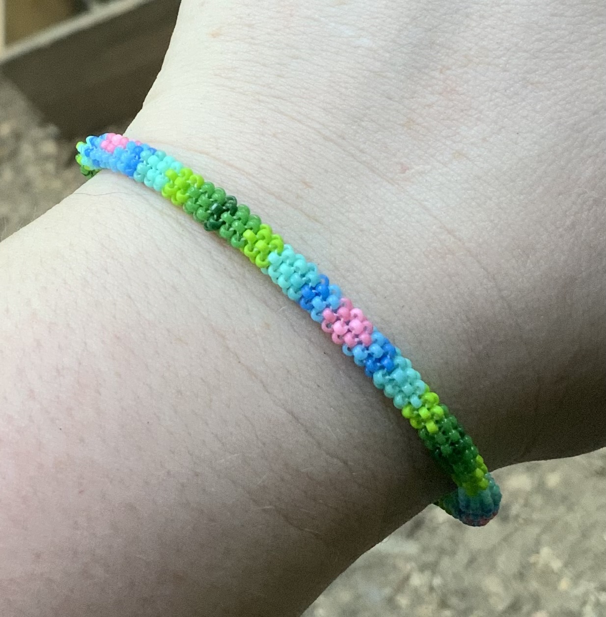 Hearts in the sky by a grassy knoll beaded bracelet