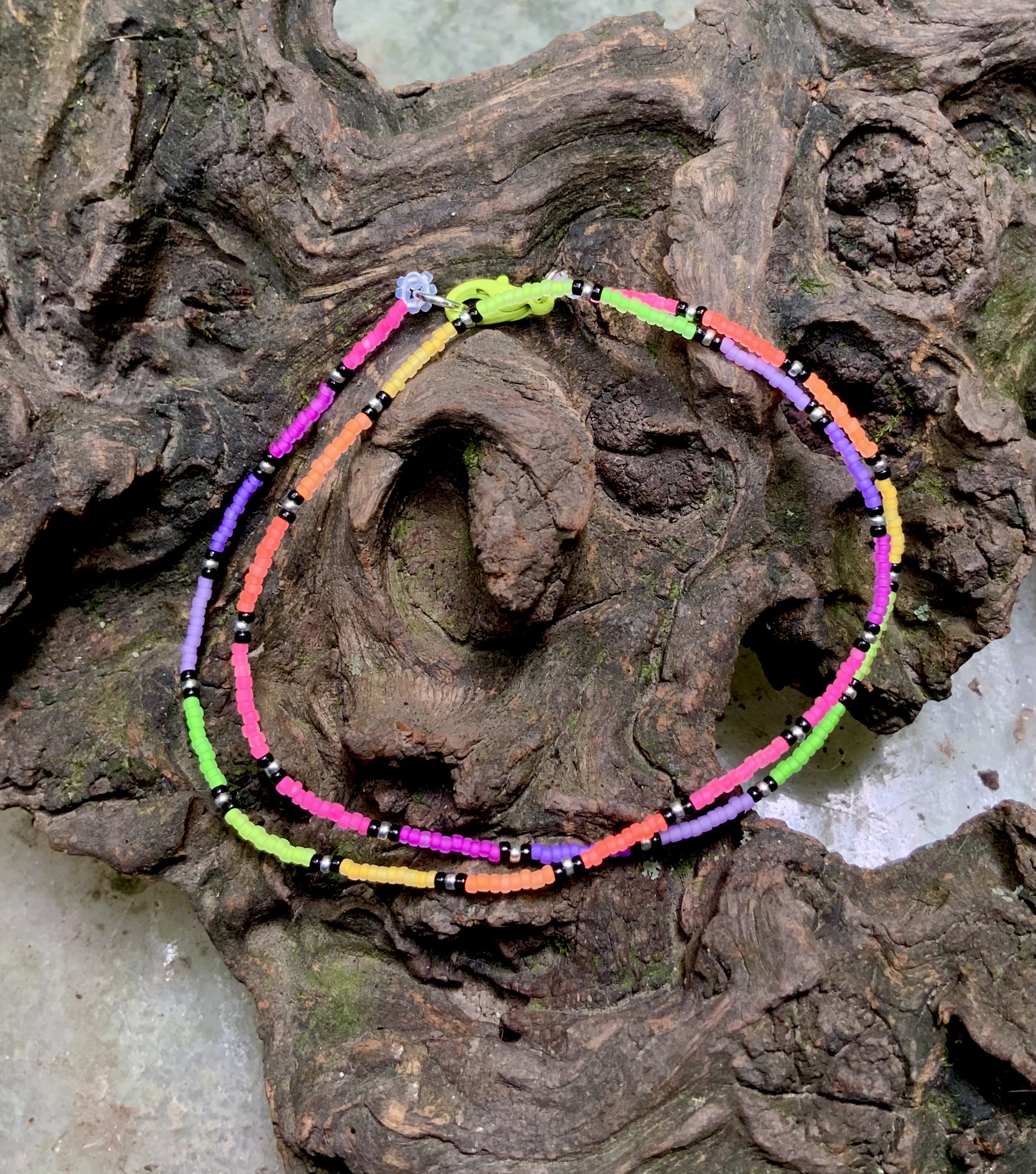 Blacklight reactive neon rainbow beaded chain