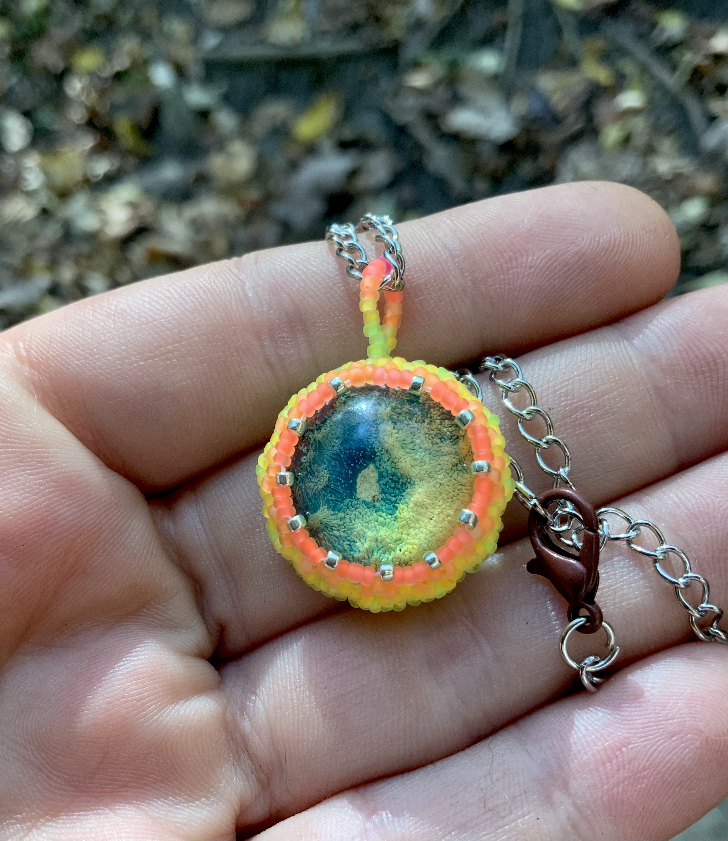 Neon blue earth beaded pendant