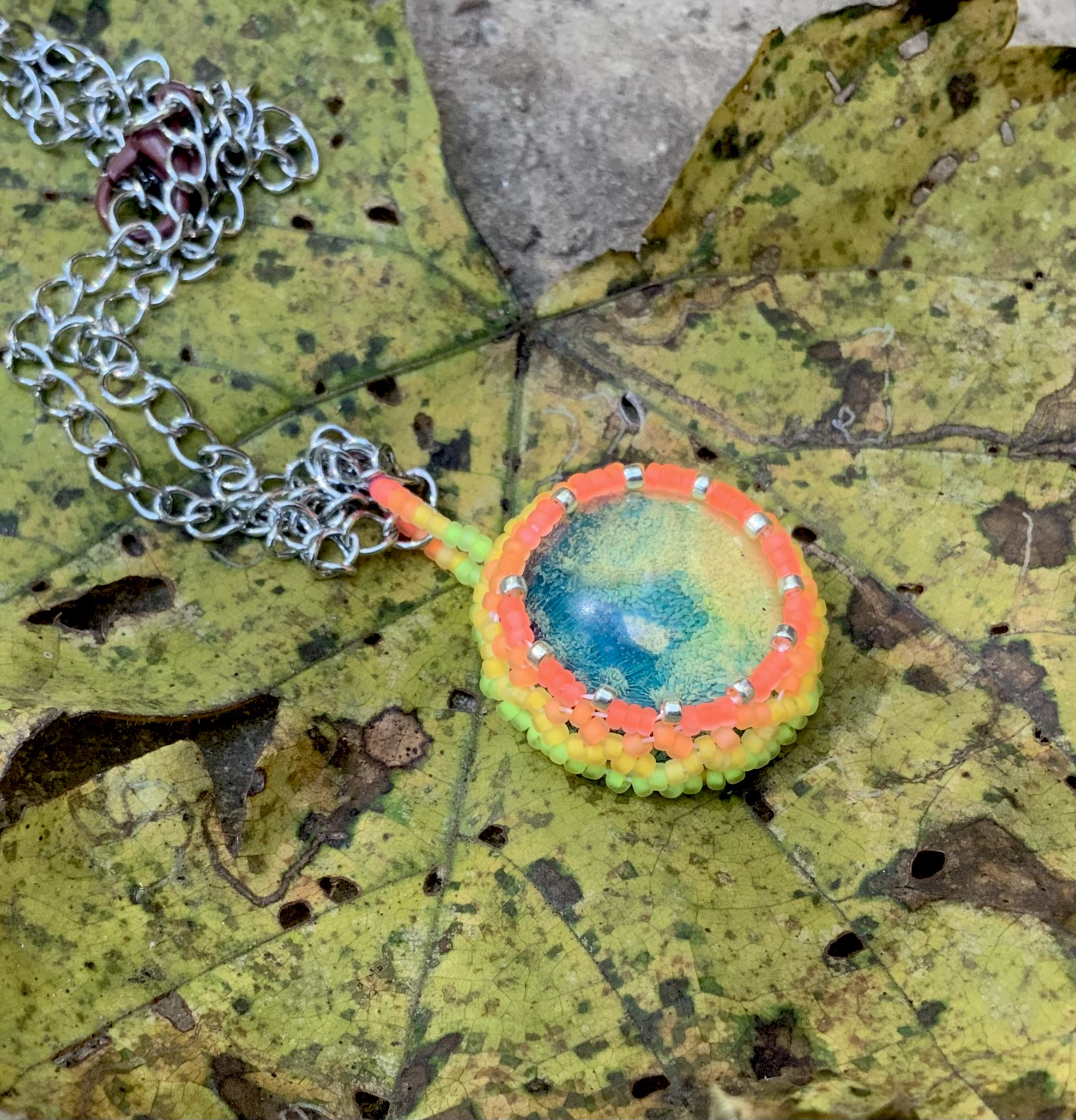 Neon blue earth beaded pendant