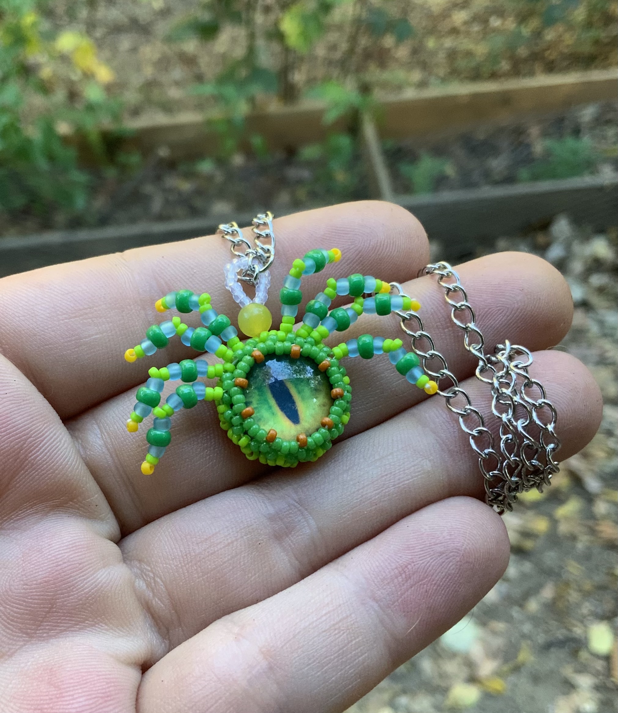 Green machine beaded spider pendant
