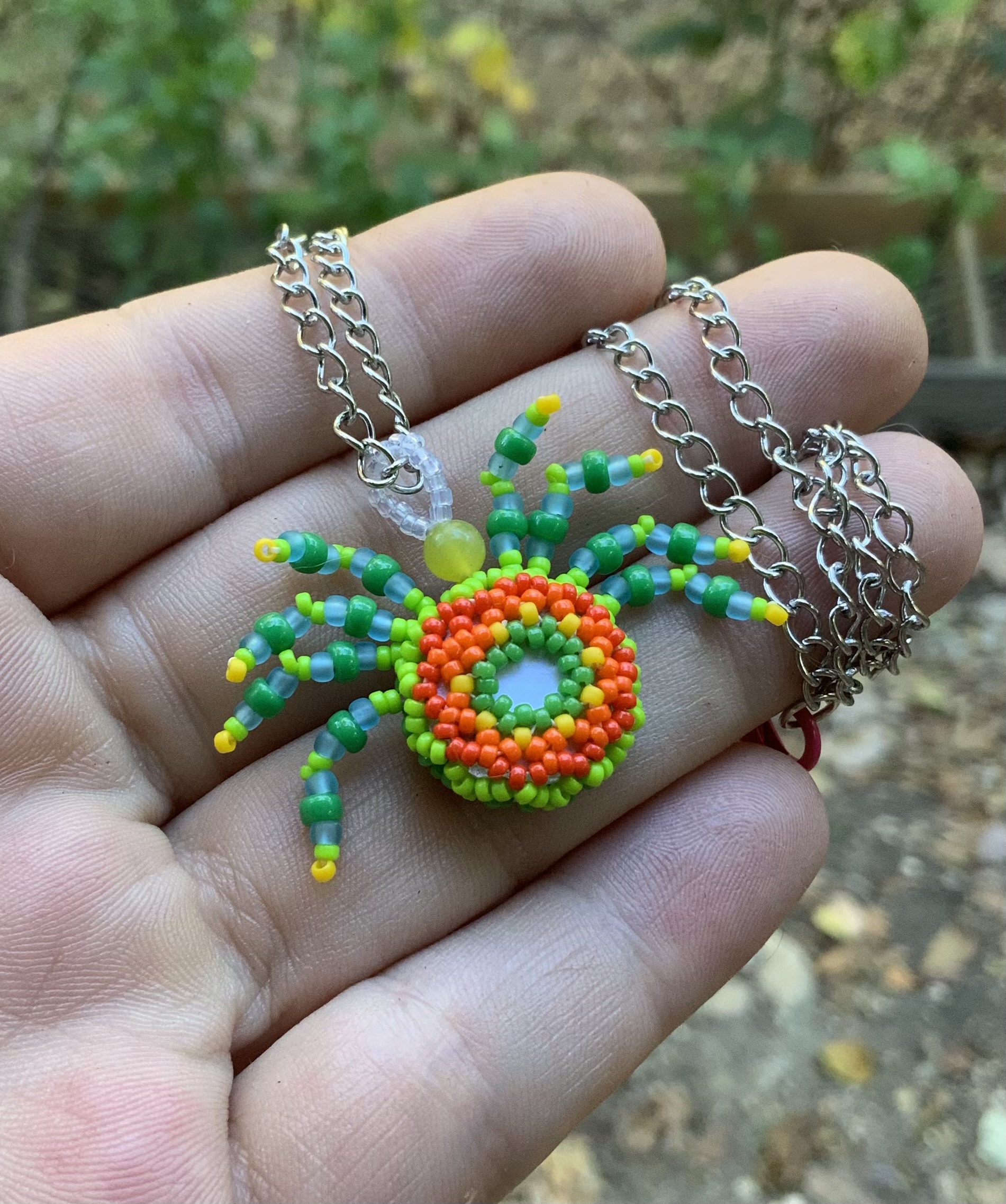 Green machine beaded spider pendant