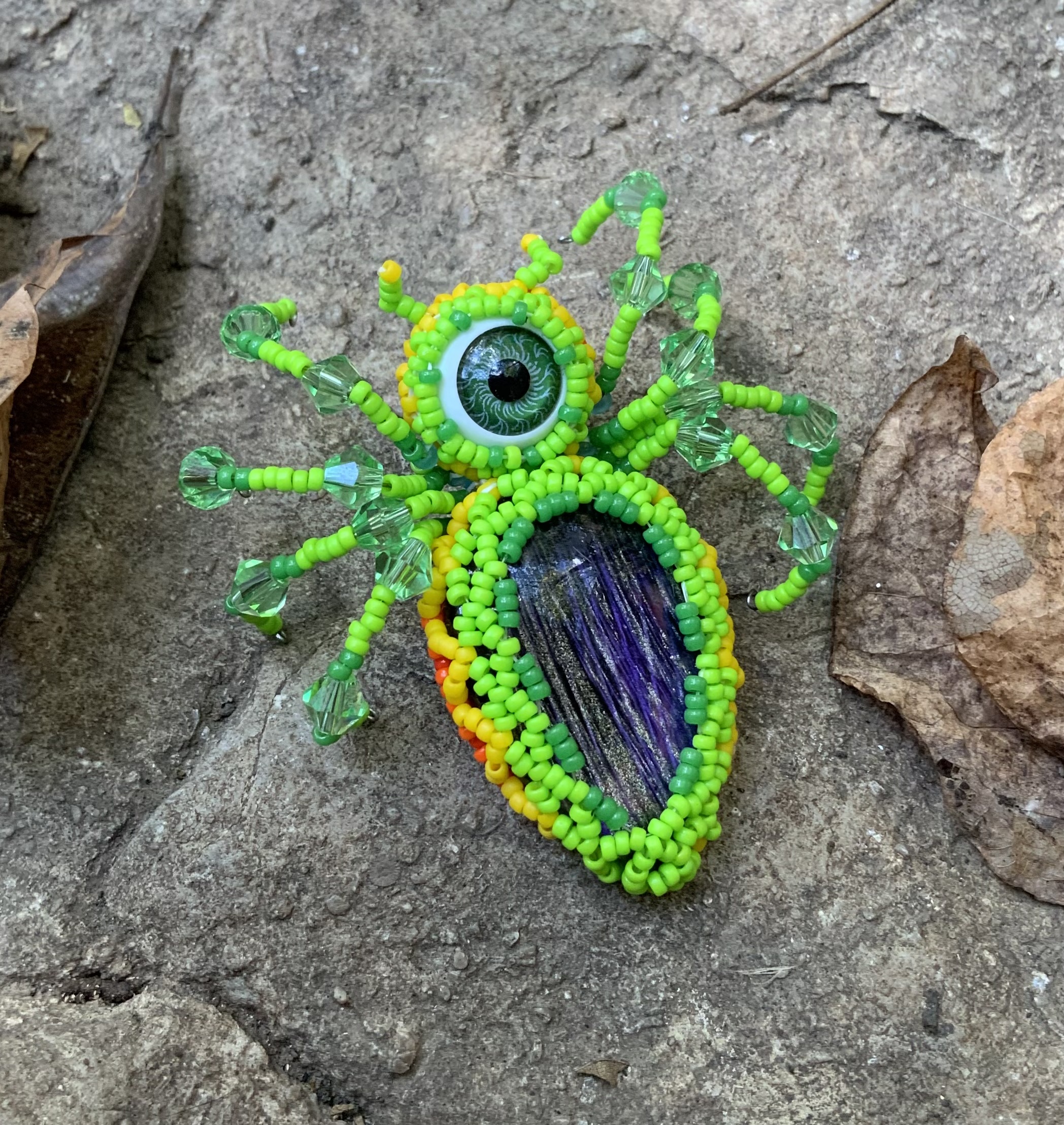 Neon green fire belly beaded spider eye guy