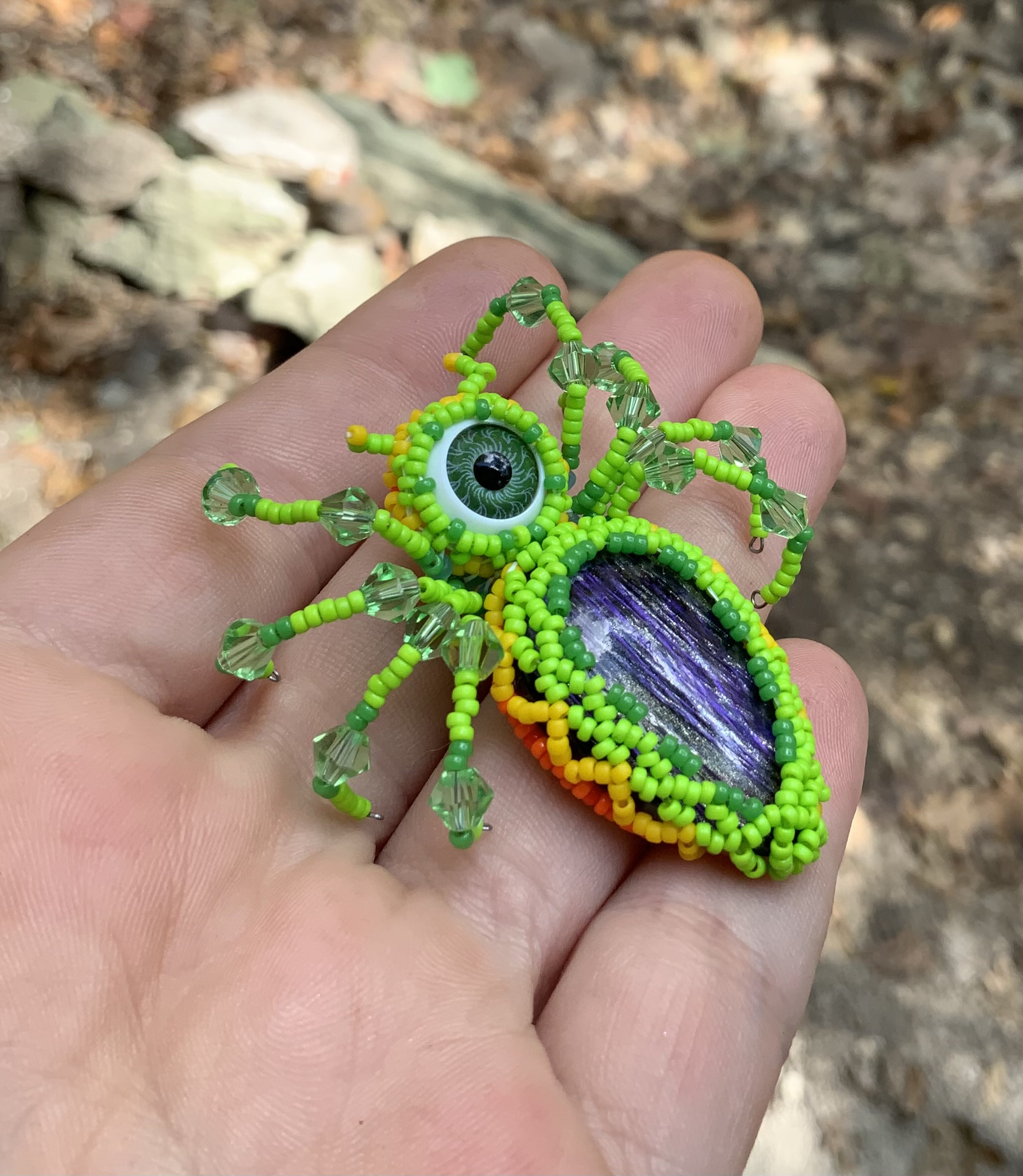 Neon green fire belly beaded spider eye guy
