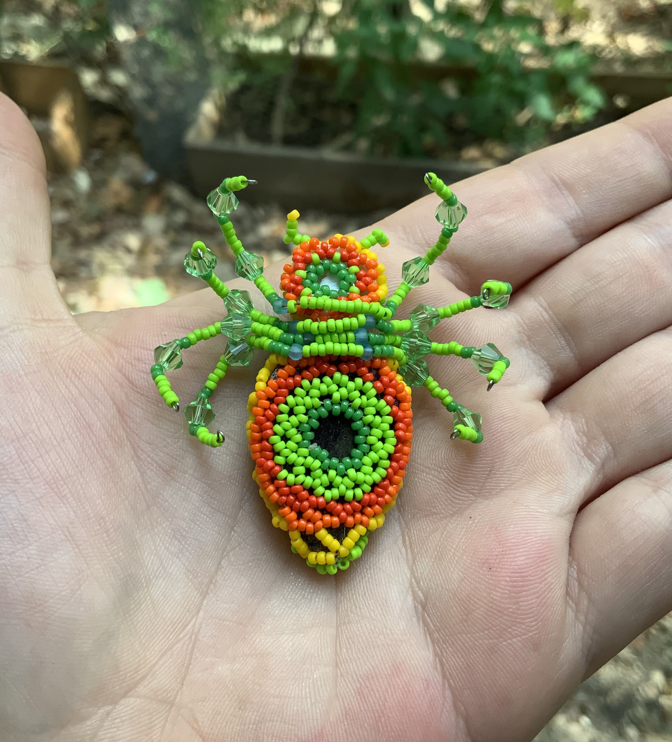 Neon green fire belly beaded spider eye guy