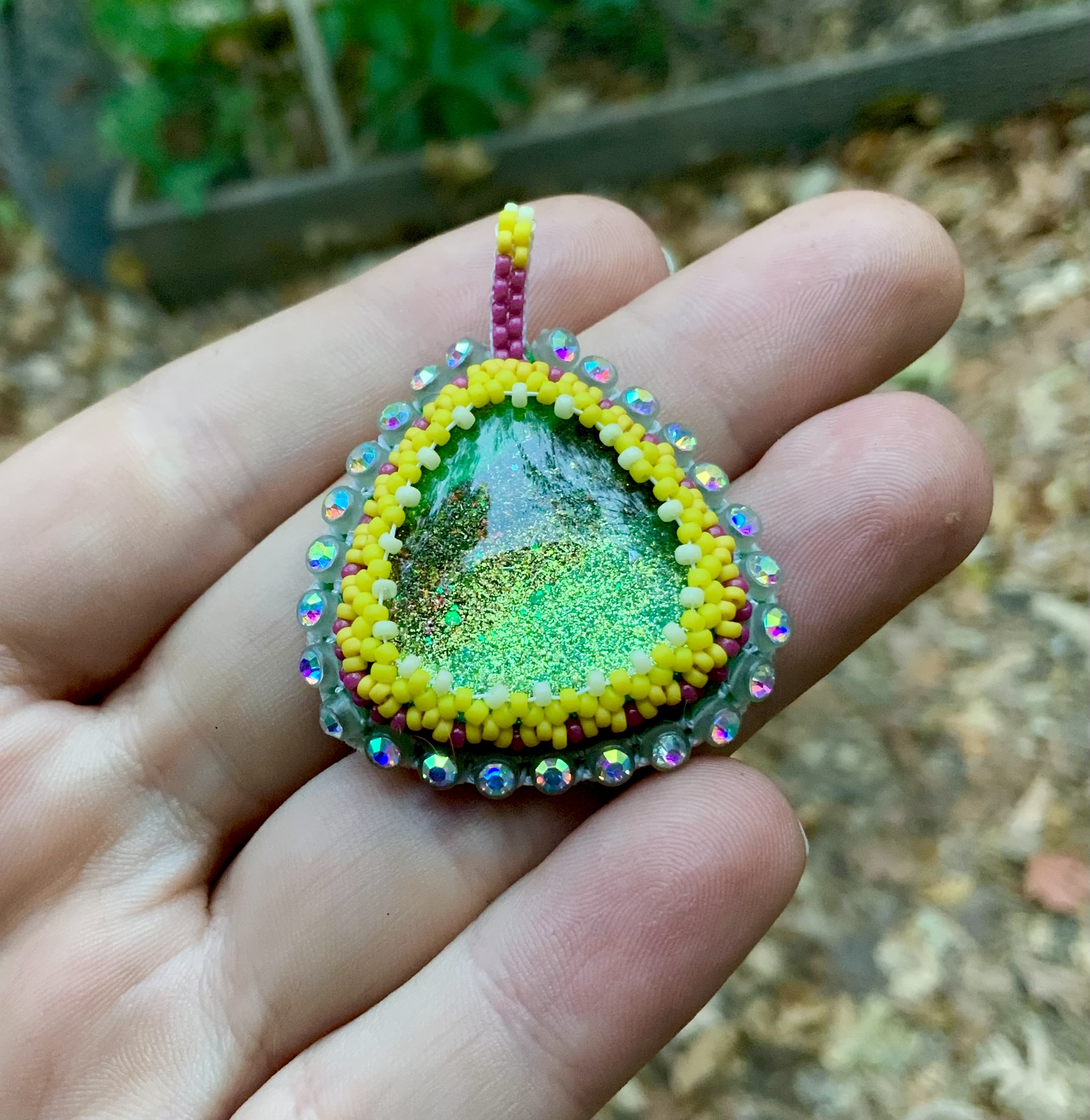Glow in the dark earthy sunshine beaded pendant
