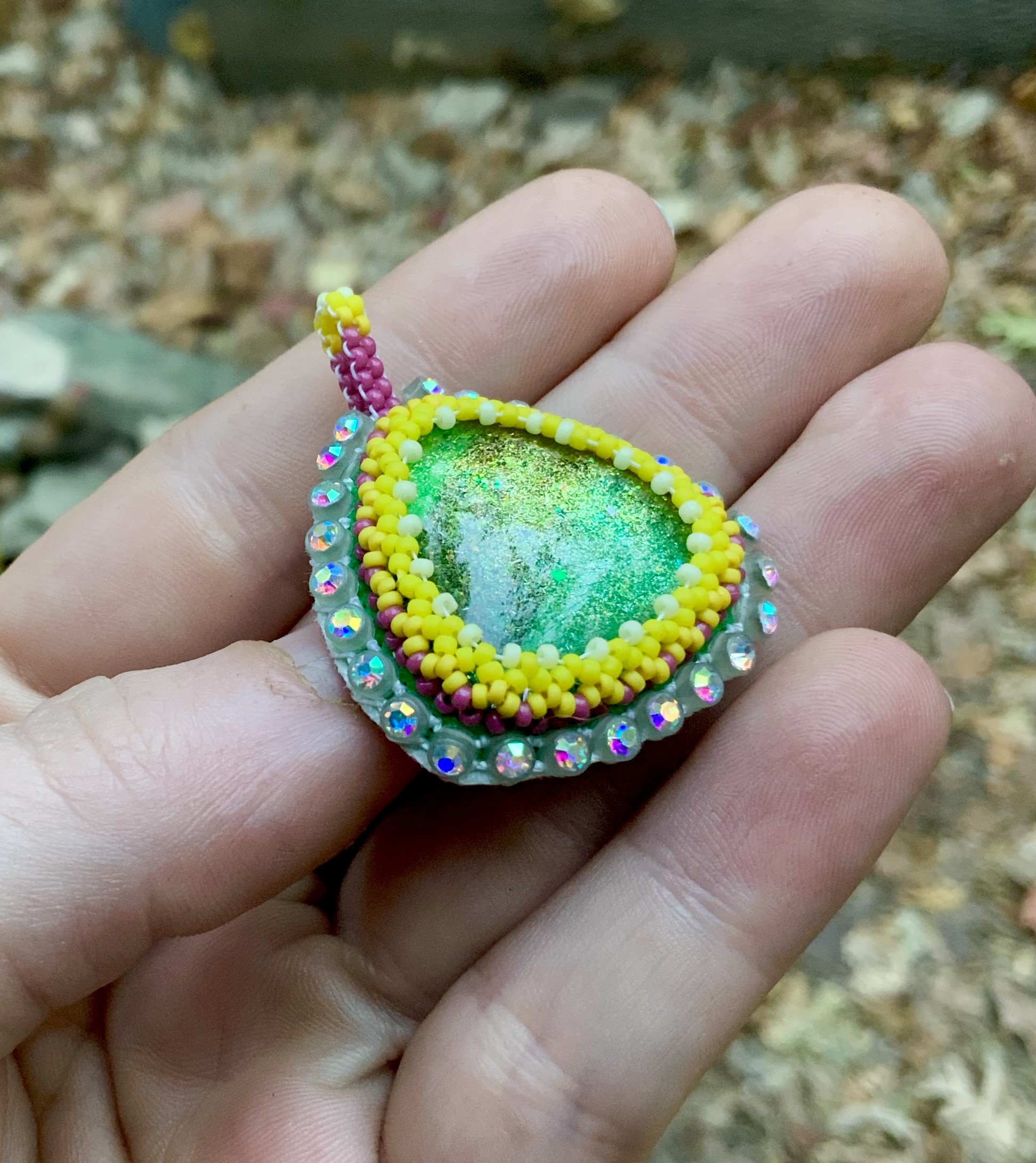 Glow in the dark earthy sunshine beaded pendant