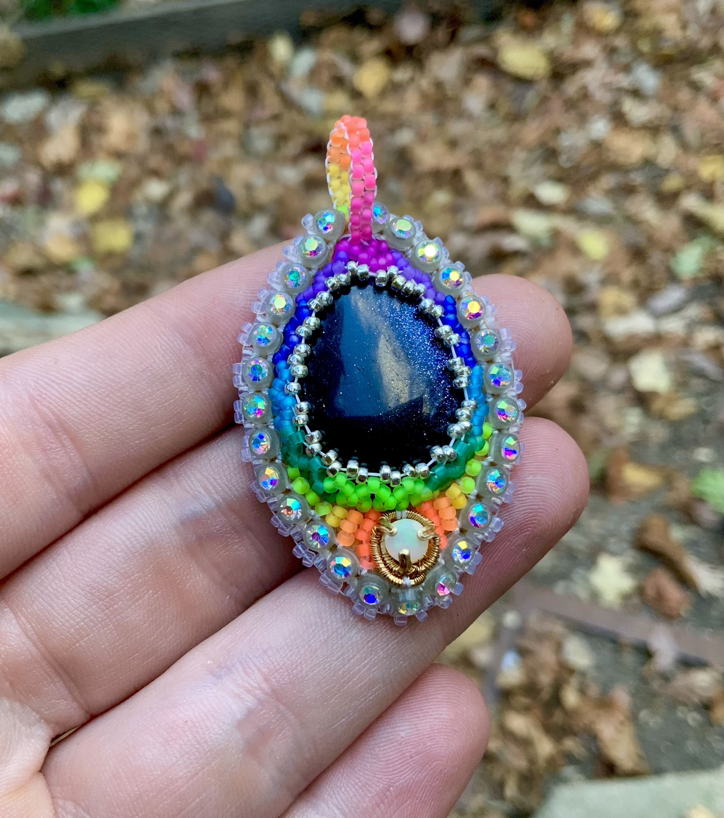 Glow in the dark and blacklight reactive opal and sunstone beaded amulet