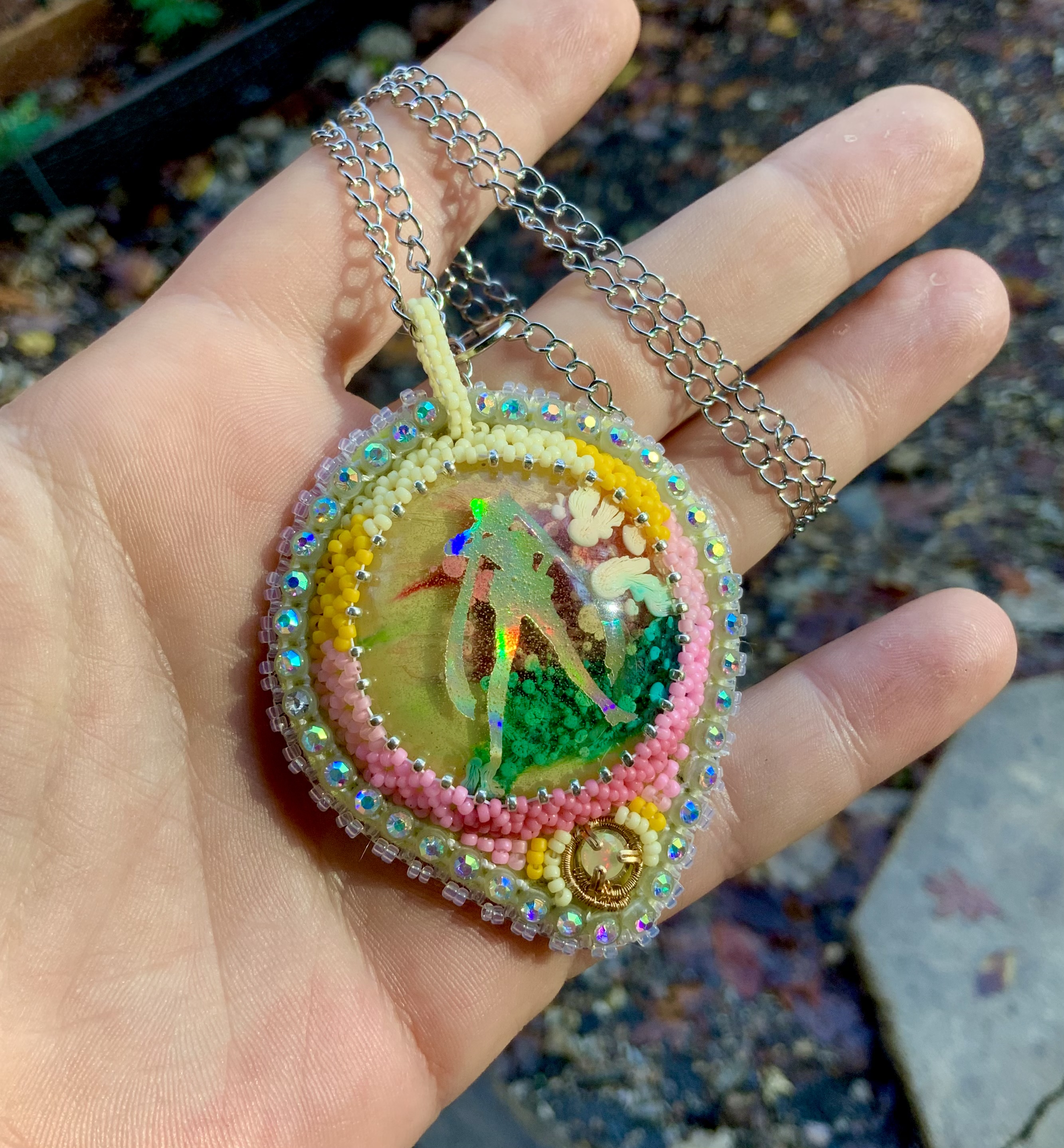 Beaded glow in the dark and blacklight reactive sailor moon amulet