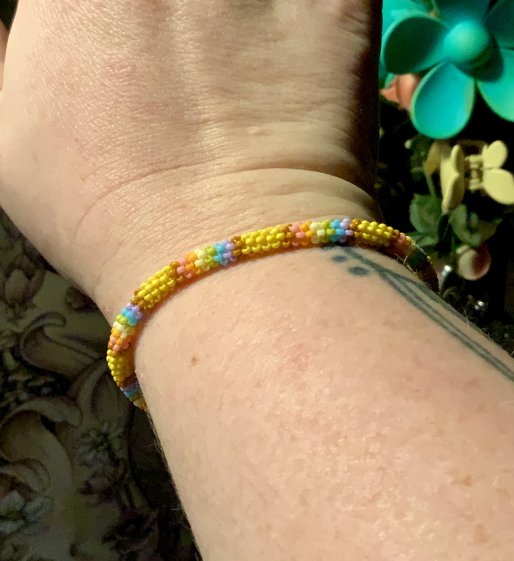 Pastel rainbow gourd stitched roll on bracelet