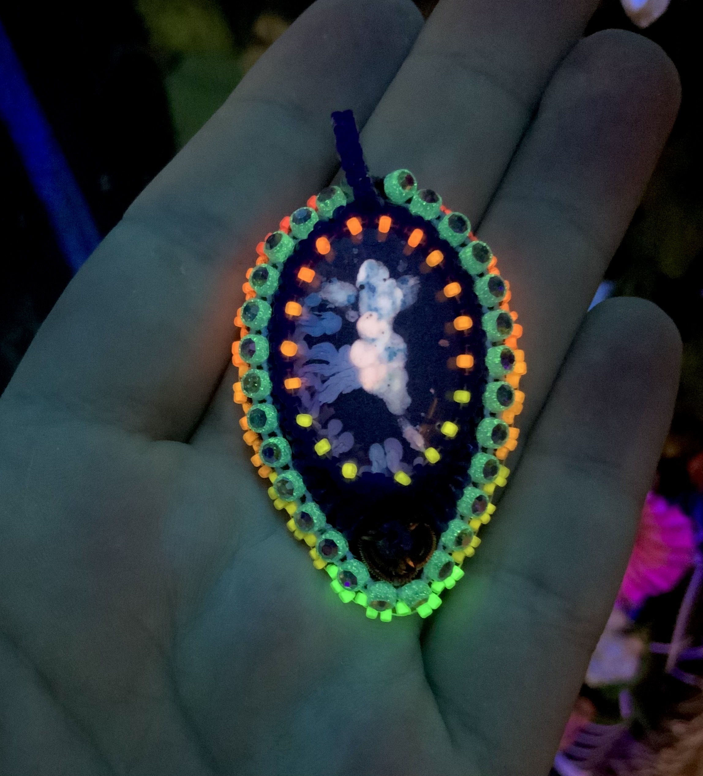 Blacklight reactive glow in the dark blue hue beaded pendant