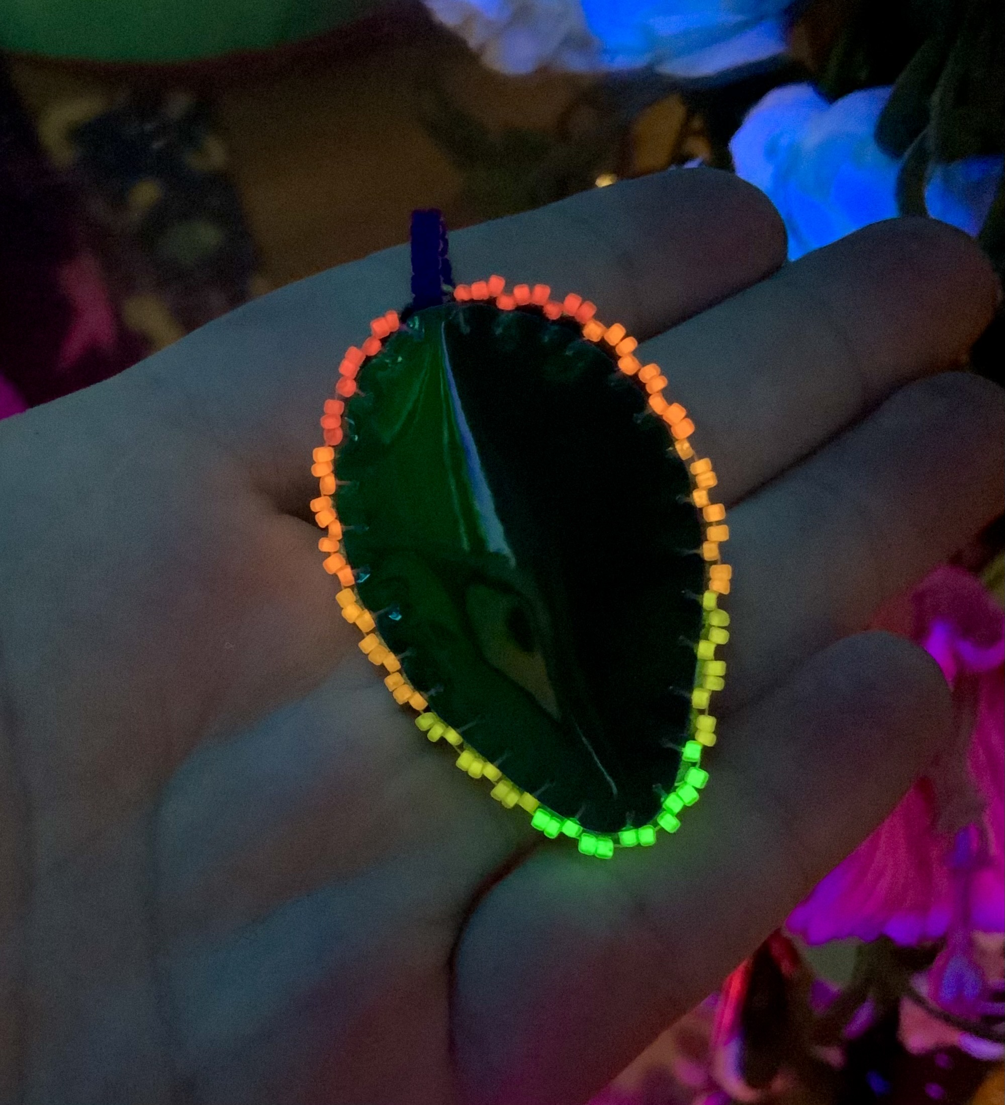 Blacklight reactive glow in the dark blue hue beaded pendant