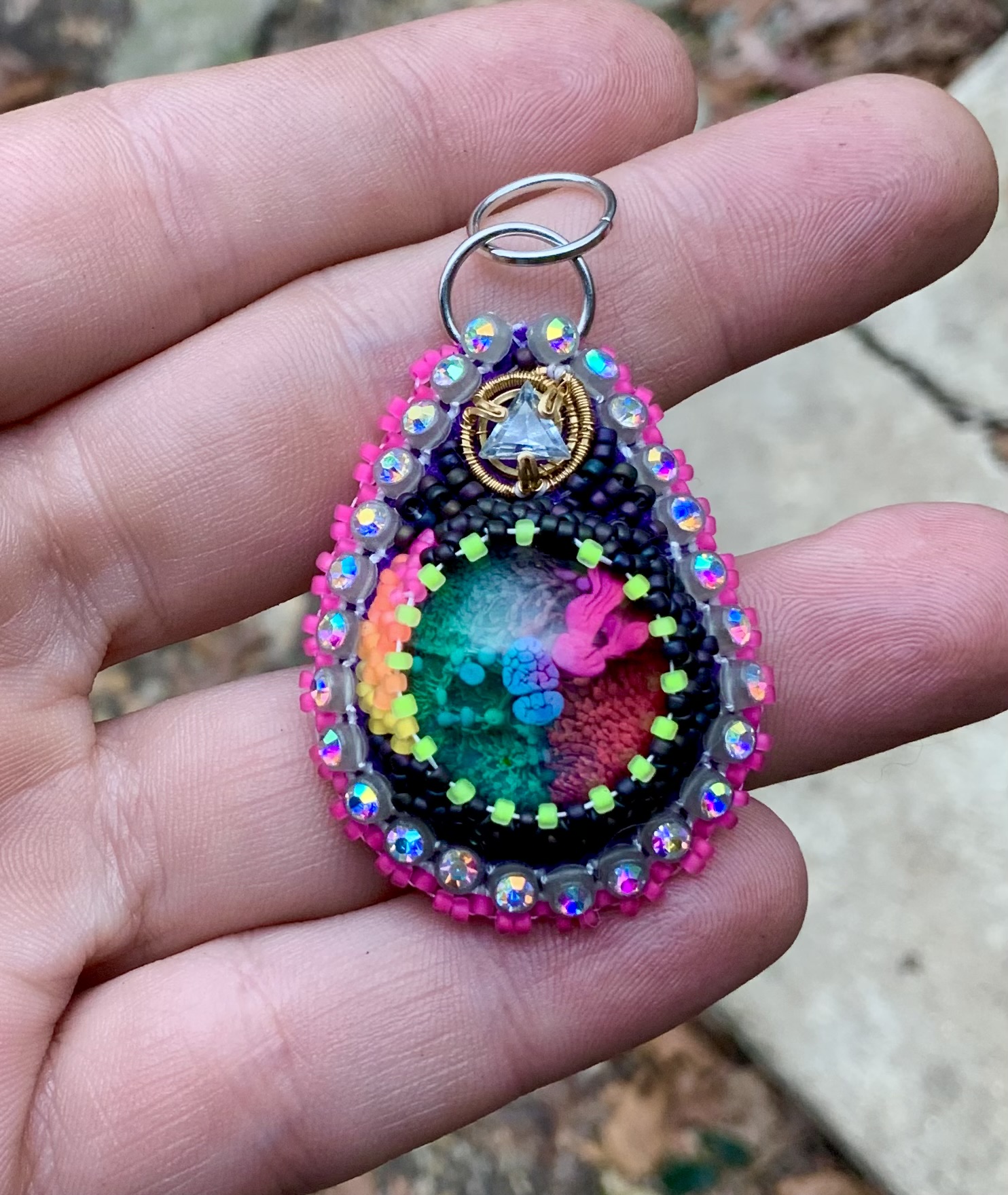 Dark rainbow beaded pendant with topaz 