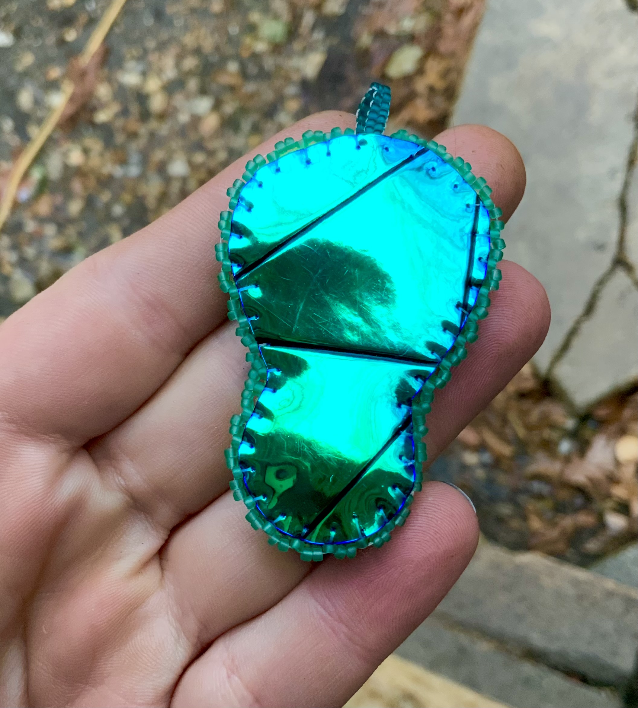 Deep teal and neon rainbow beaded pendant 