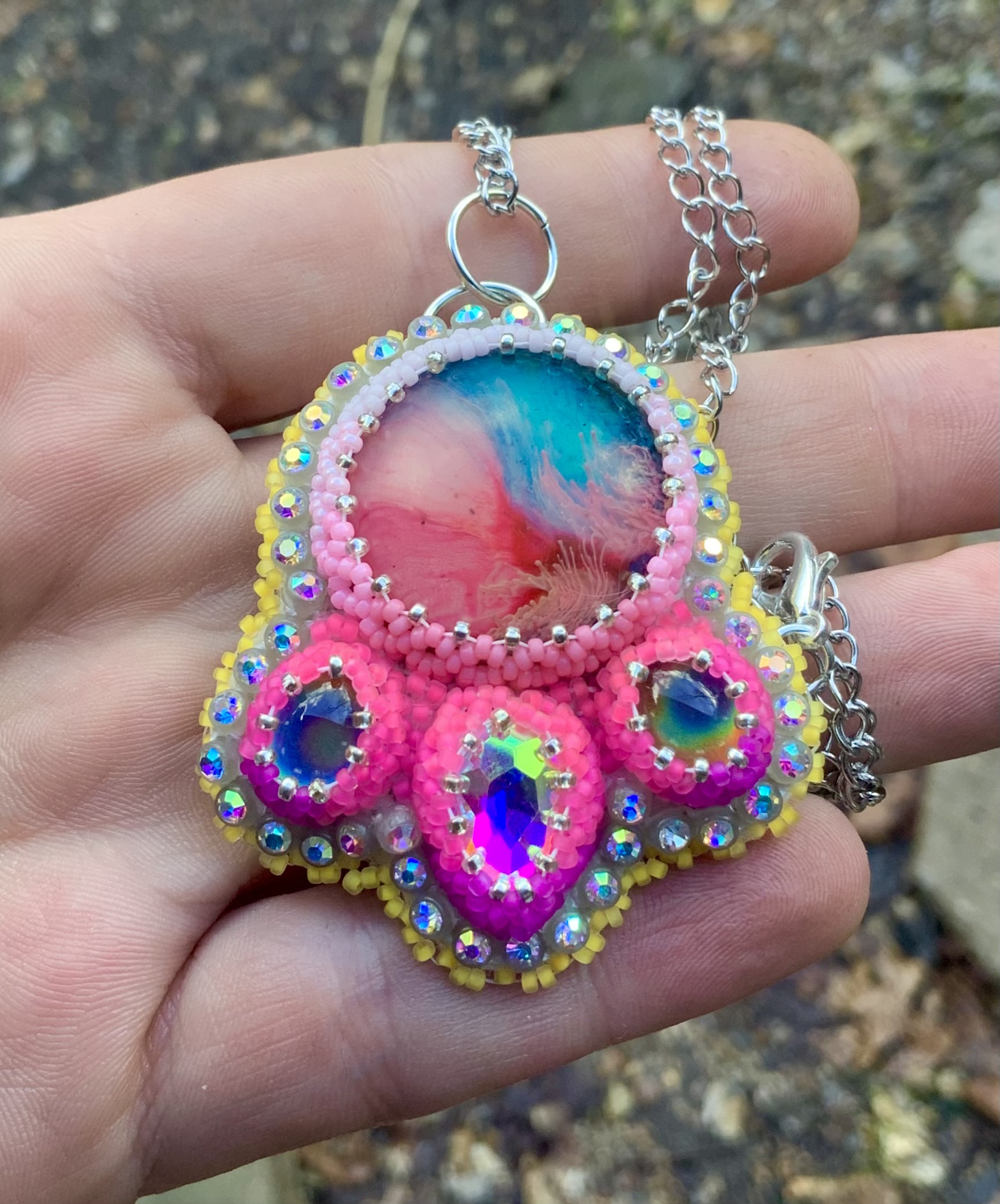 Neon pink Blacklight reactive beaded pendant 