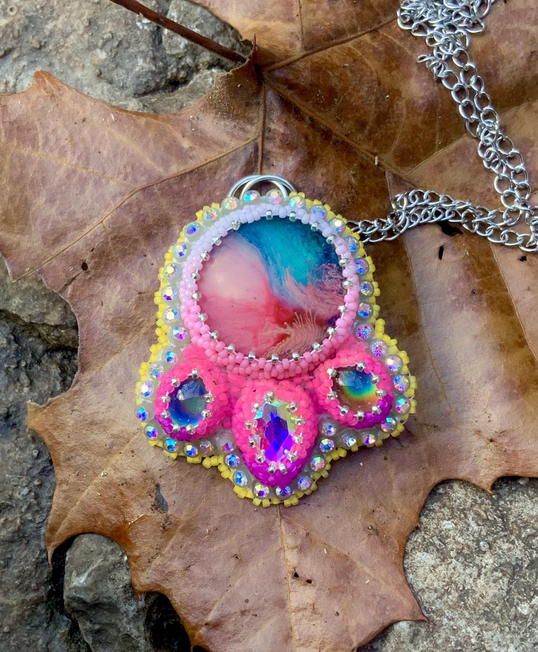 Neon pink Blacklight reactive beaded pendant 