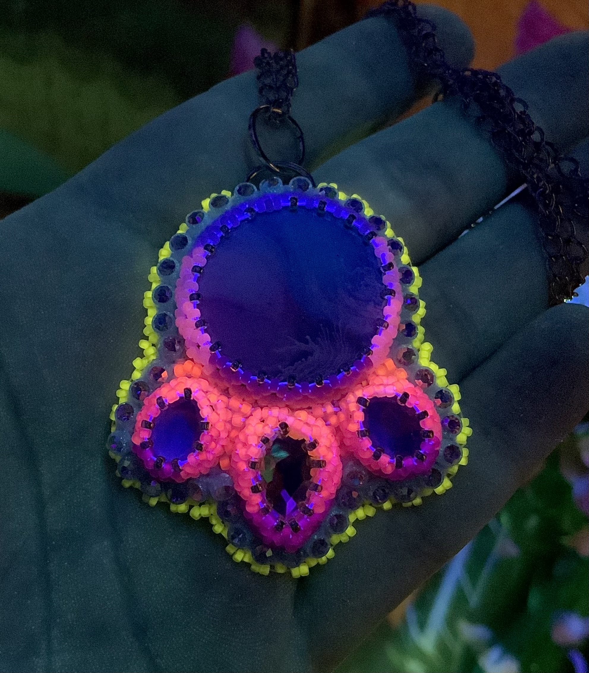 Neon pink Blacklight reactive beaded pendant 