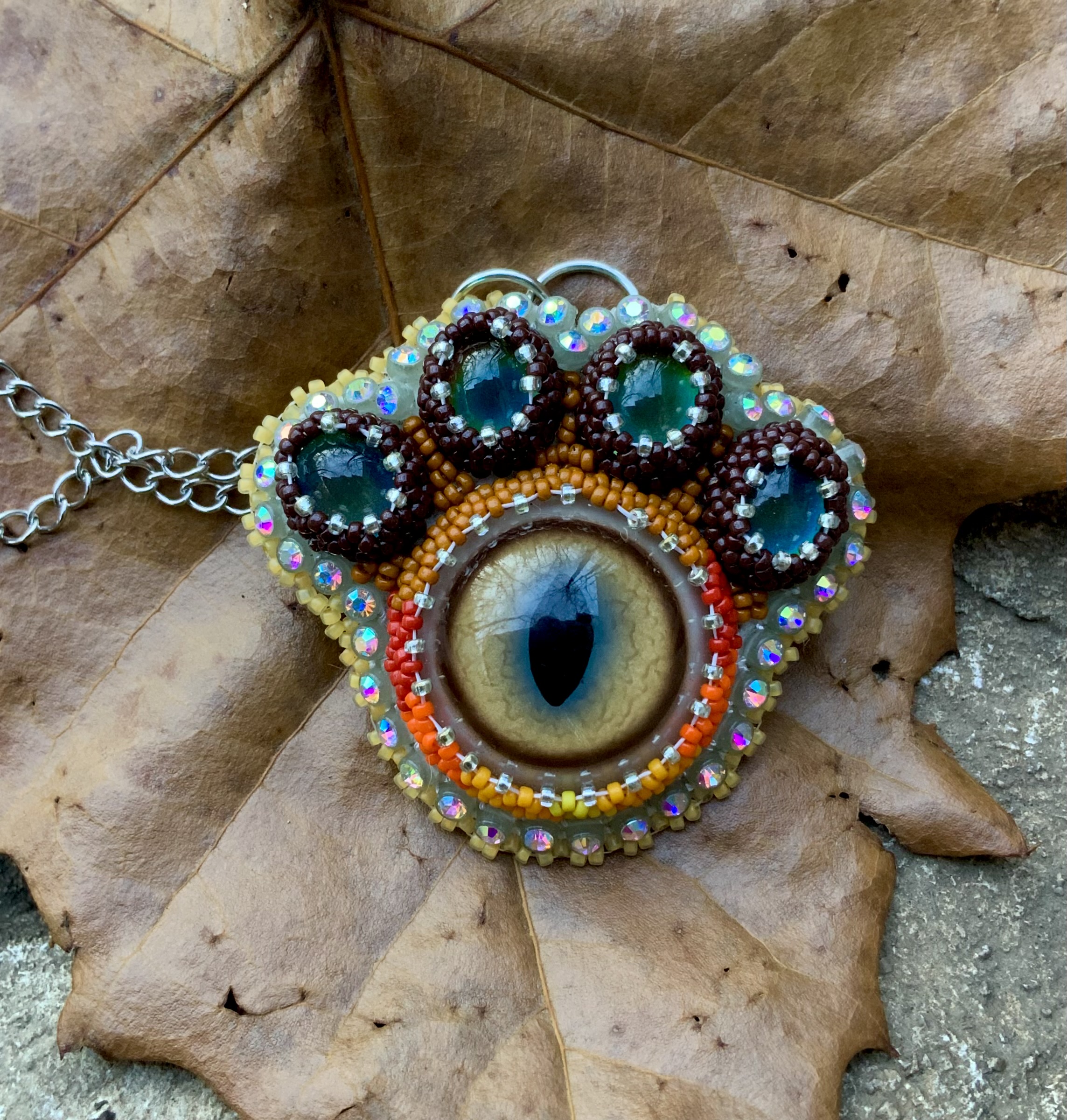 Puma paw beaded pendant with thermal color change