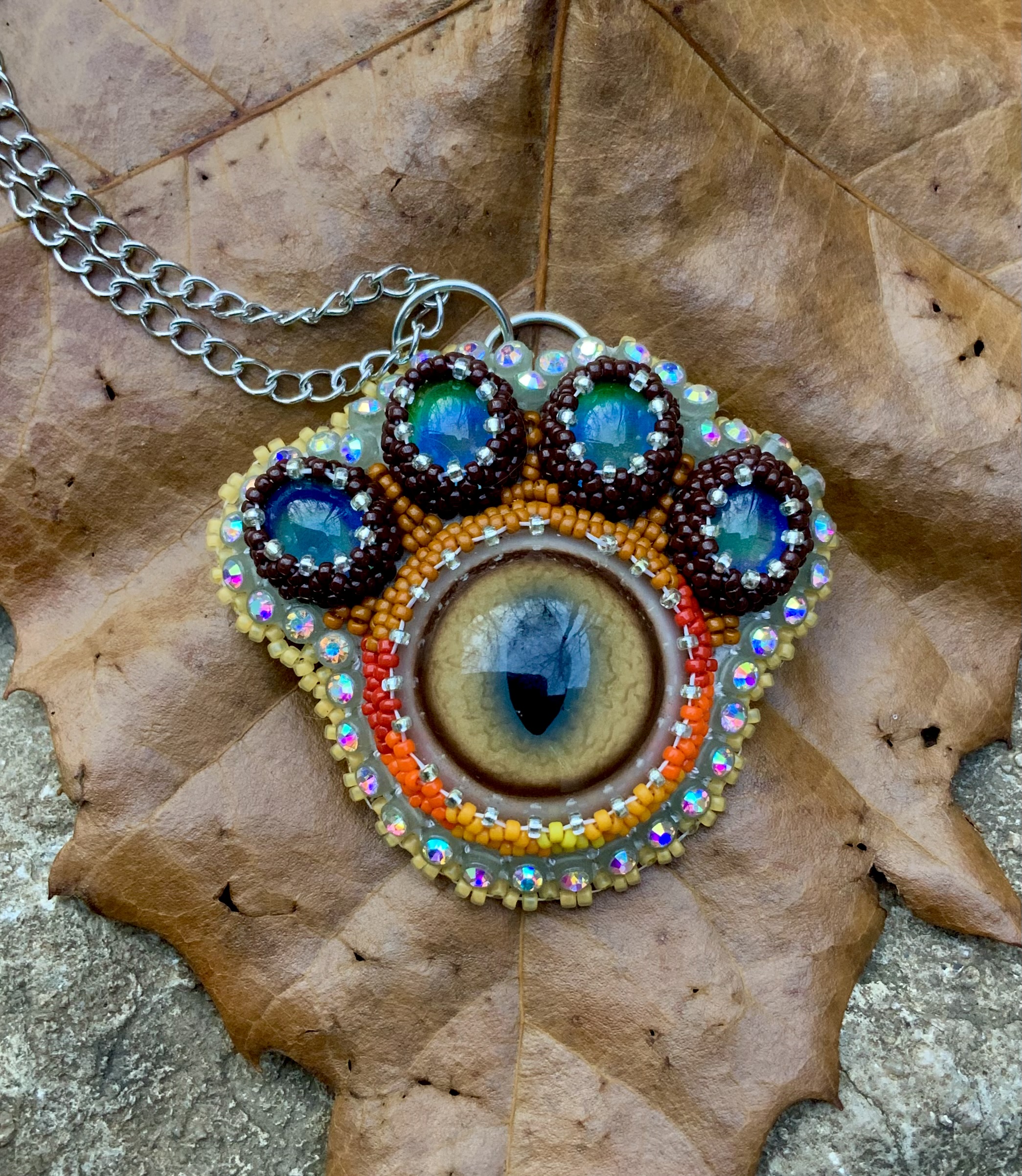 Puma paw beaded pendant with thermal color change