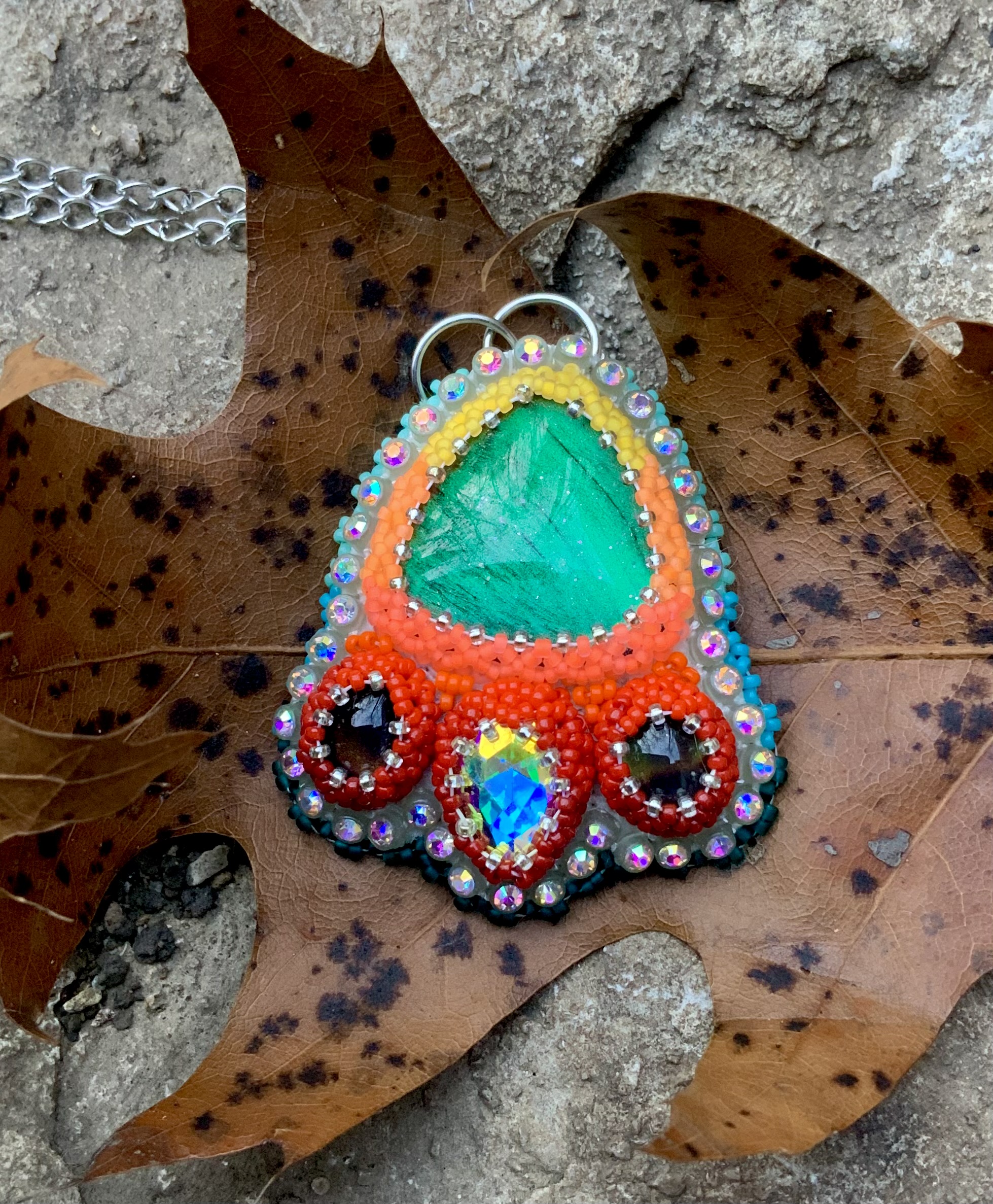 Teal phoenix beaded pendant