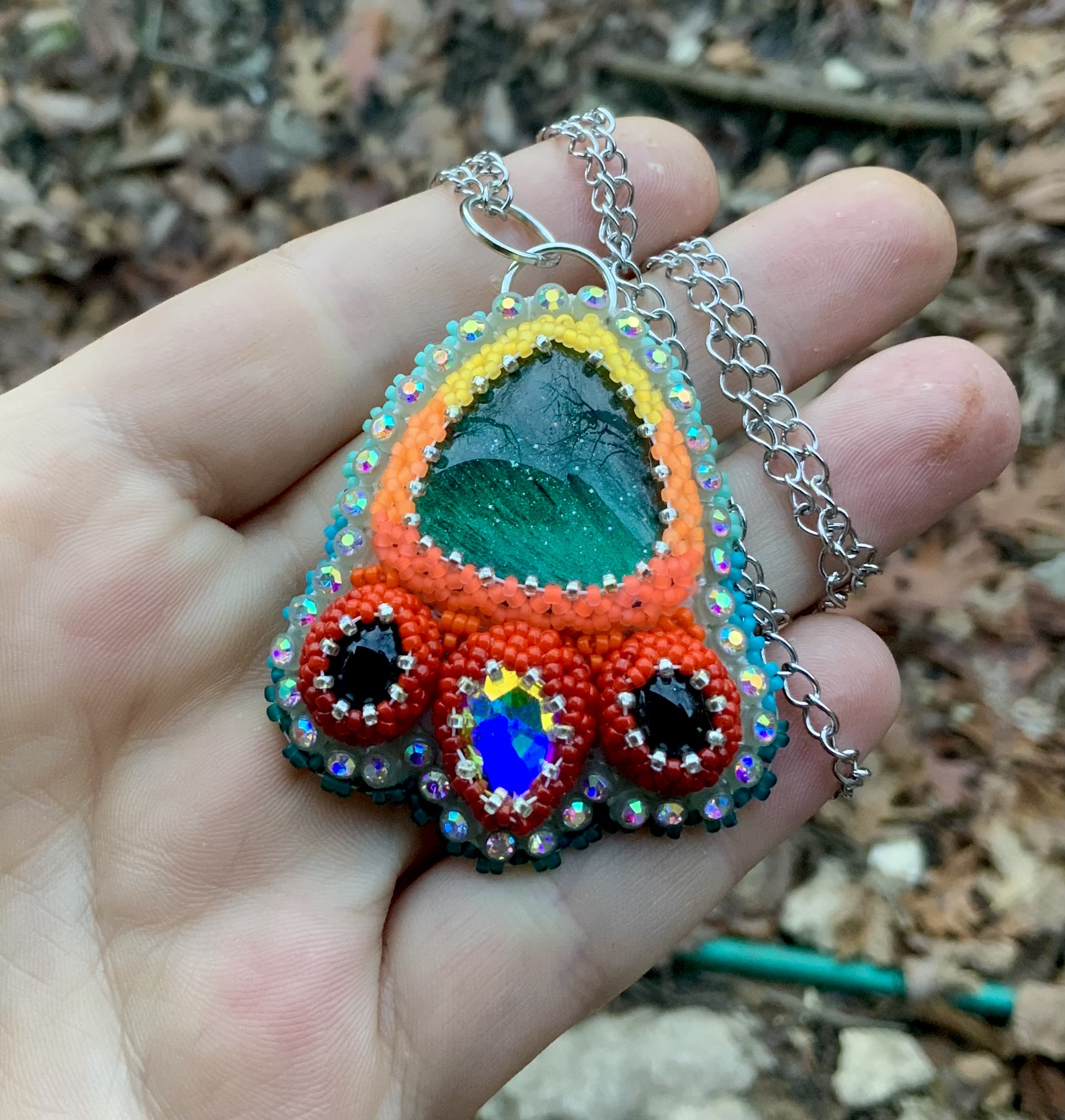 Teal phoenix beaded pendant