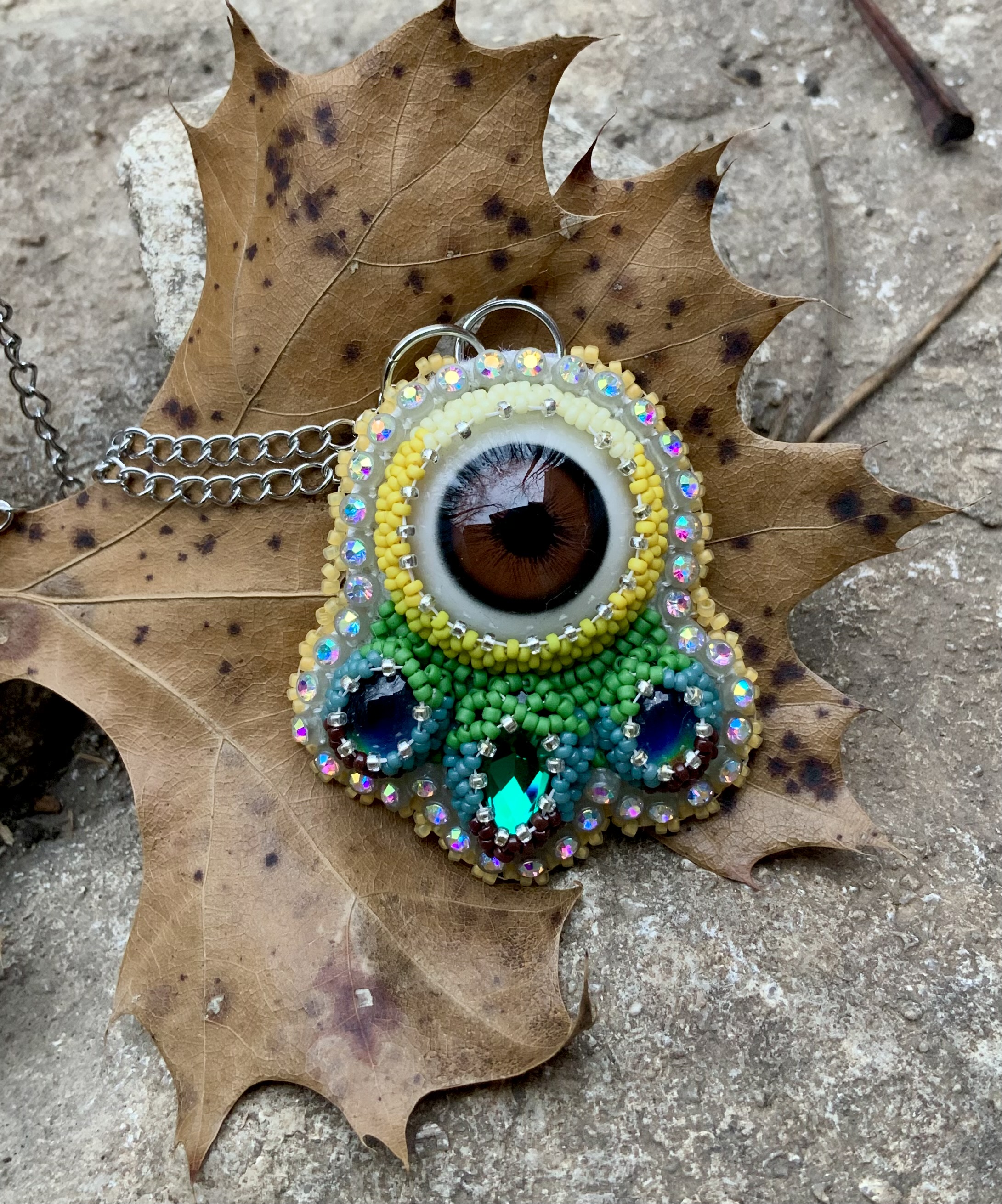 Sunflower puma eye beaded pendant