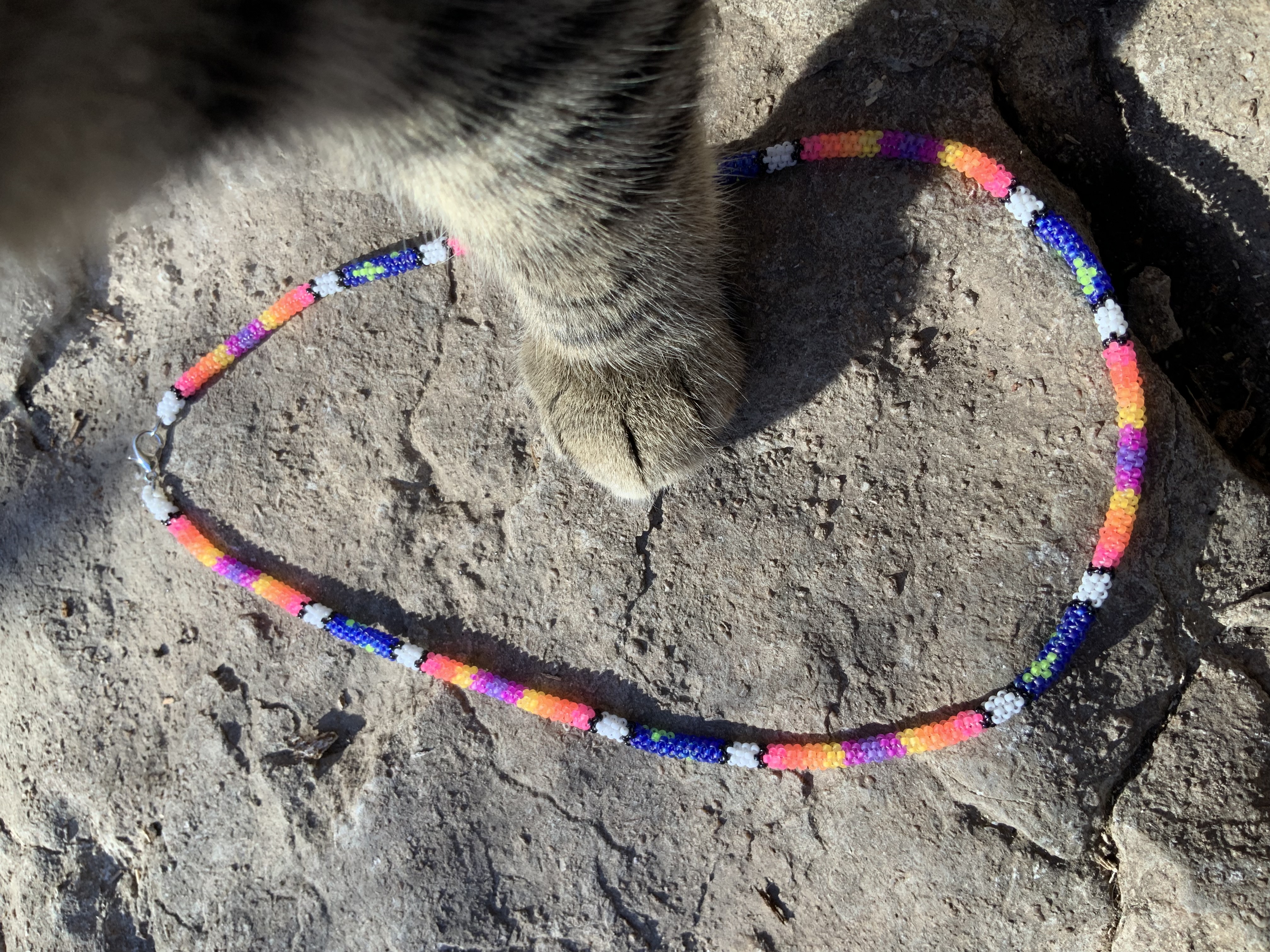 Glowing stars at sunset blacklight reactive gourd stitched necklace 