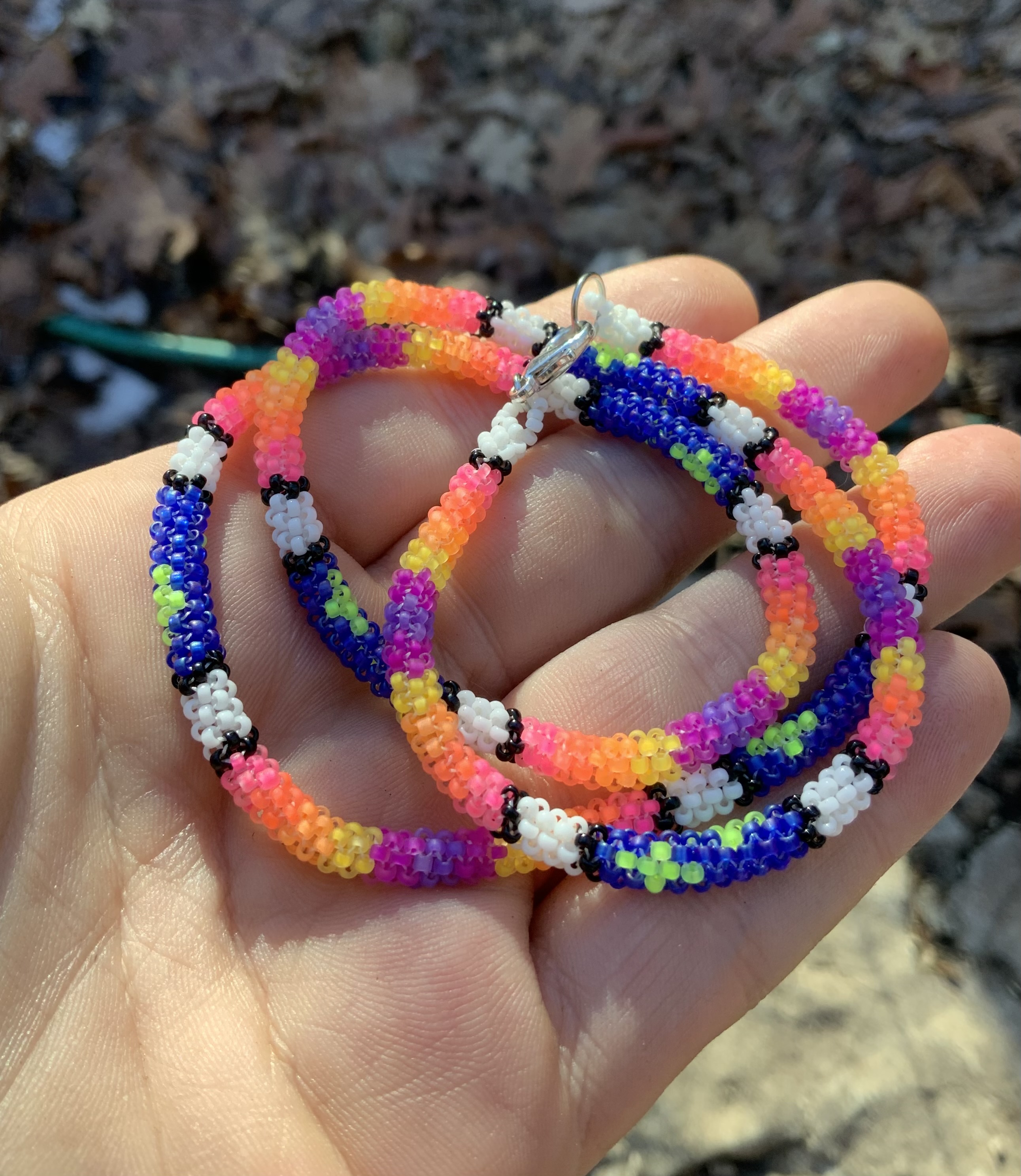 Glowing stars at sunset blacklight reactive gourd stitched necklace 