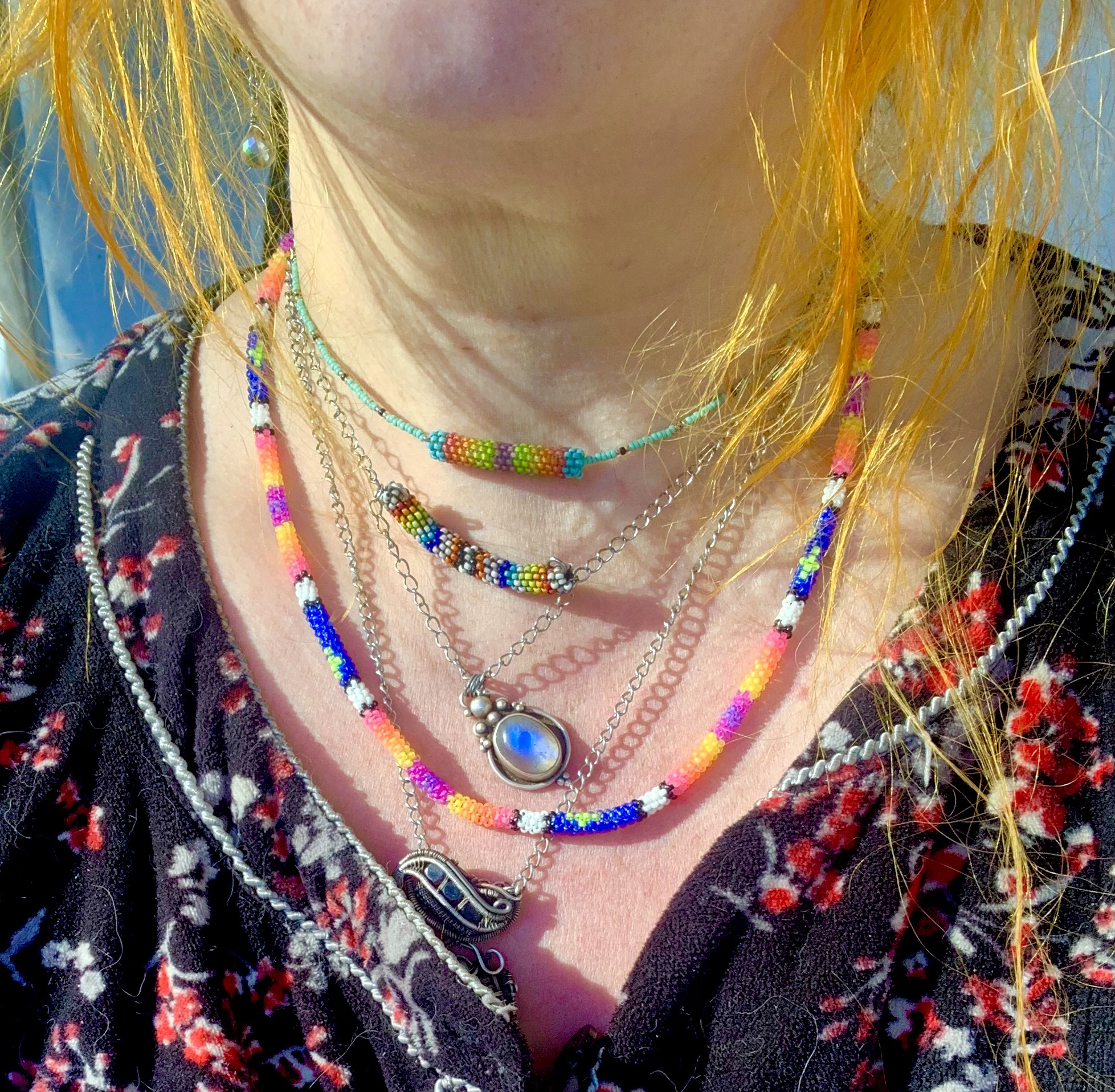 Glowing stars at sunset blacklight reactive gourd stitched necklace 
