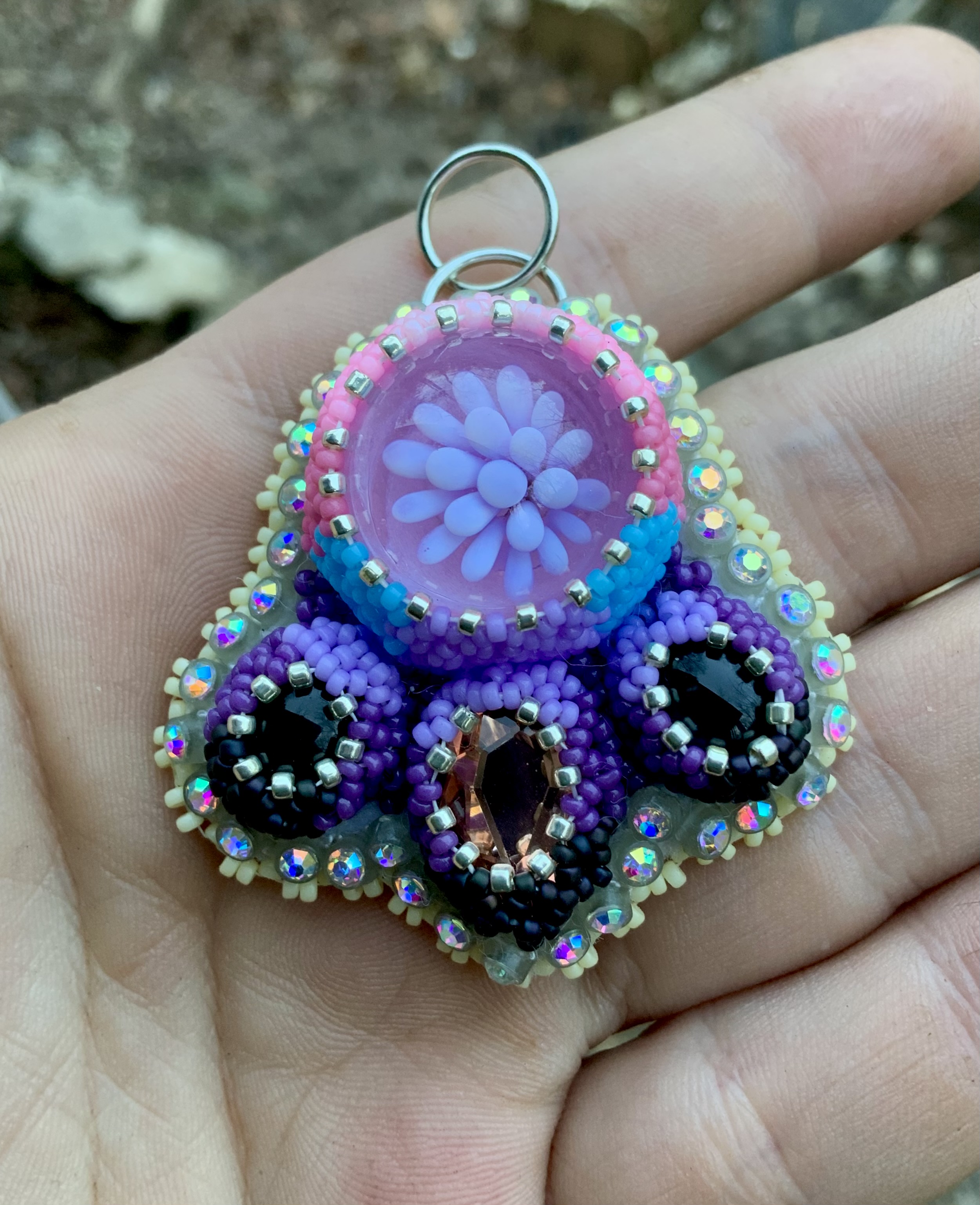 Pink and purple beaded glass implosion pendant 
