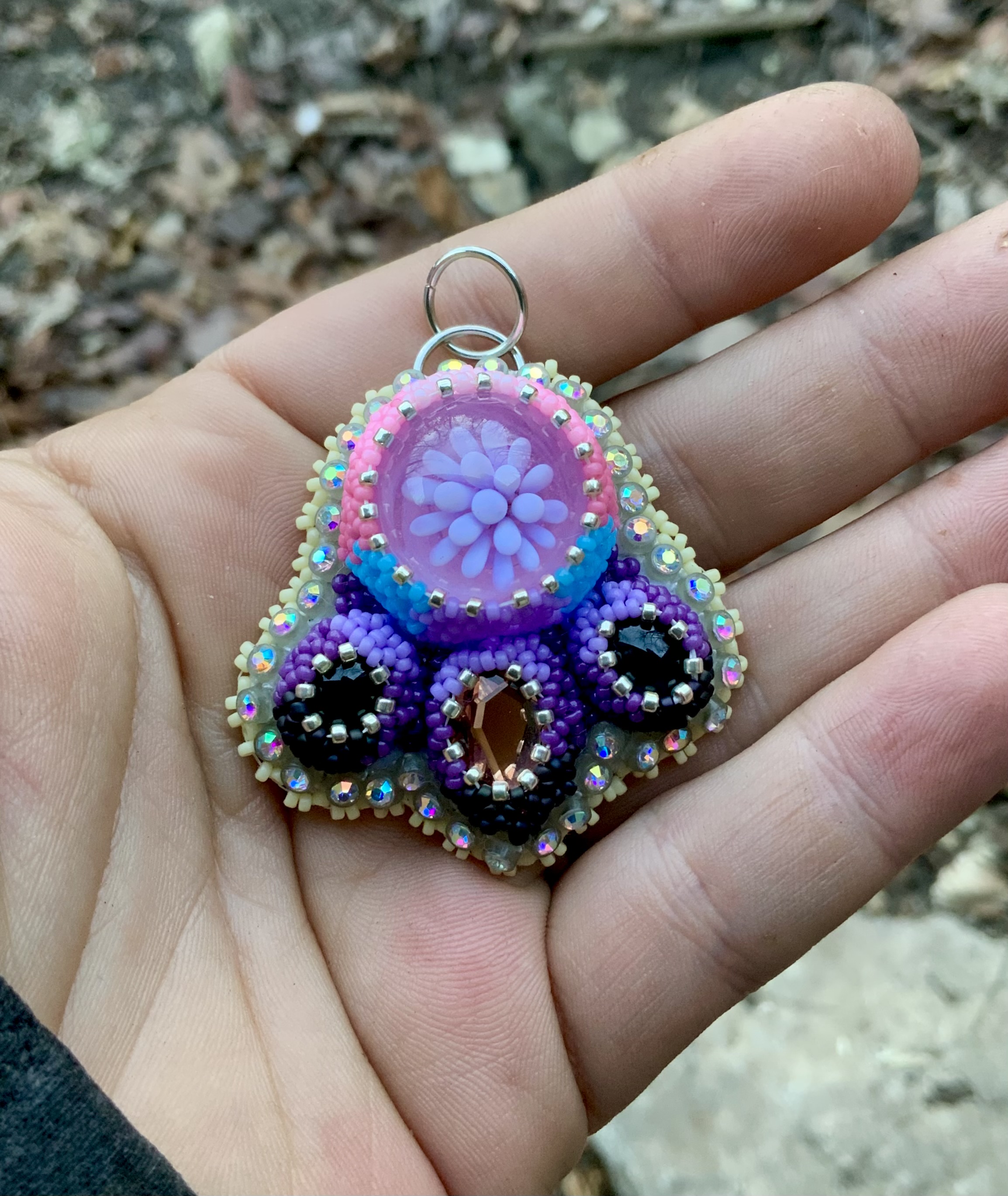 Pink and purple beaded glass implosion pendant 