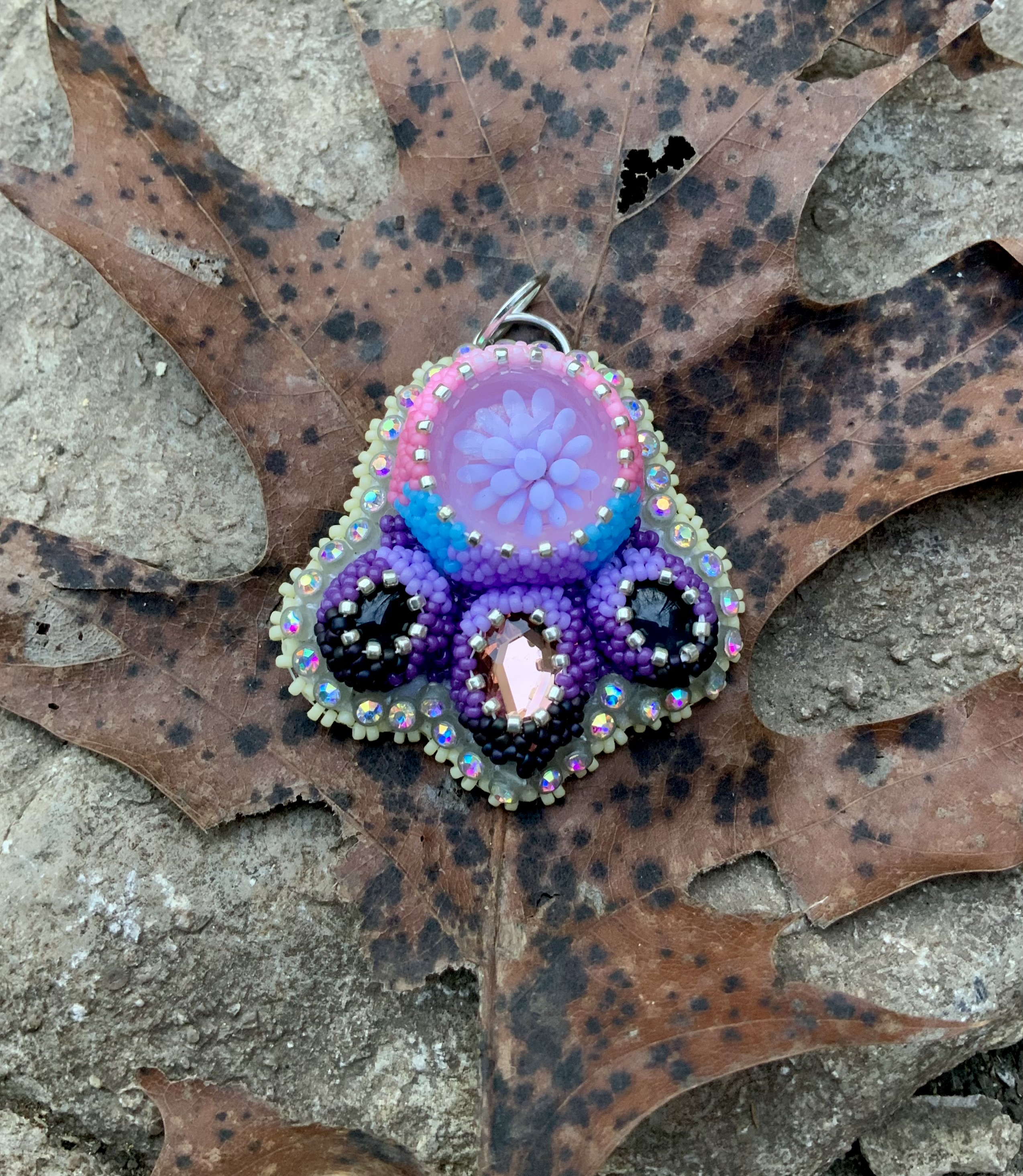 Pink and purple beaded glass implosion pendant 