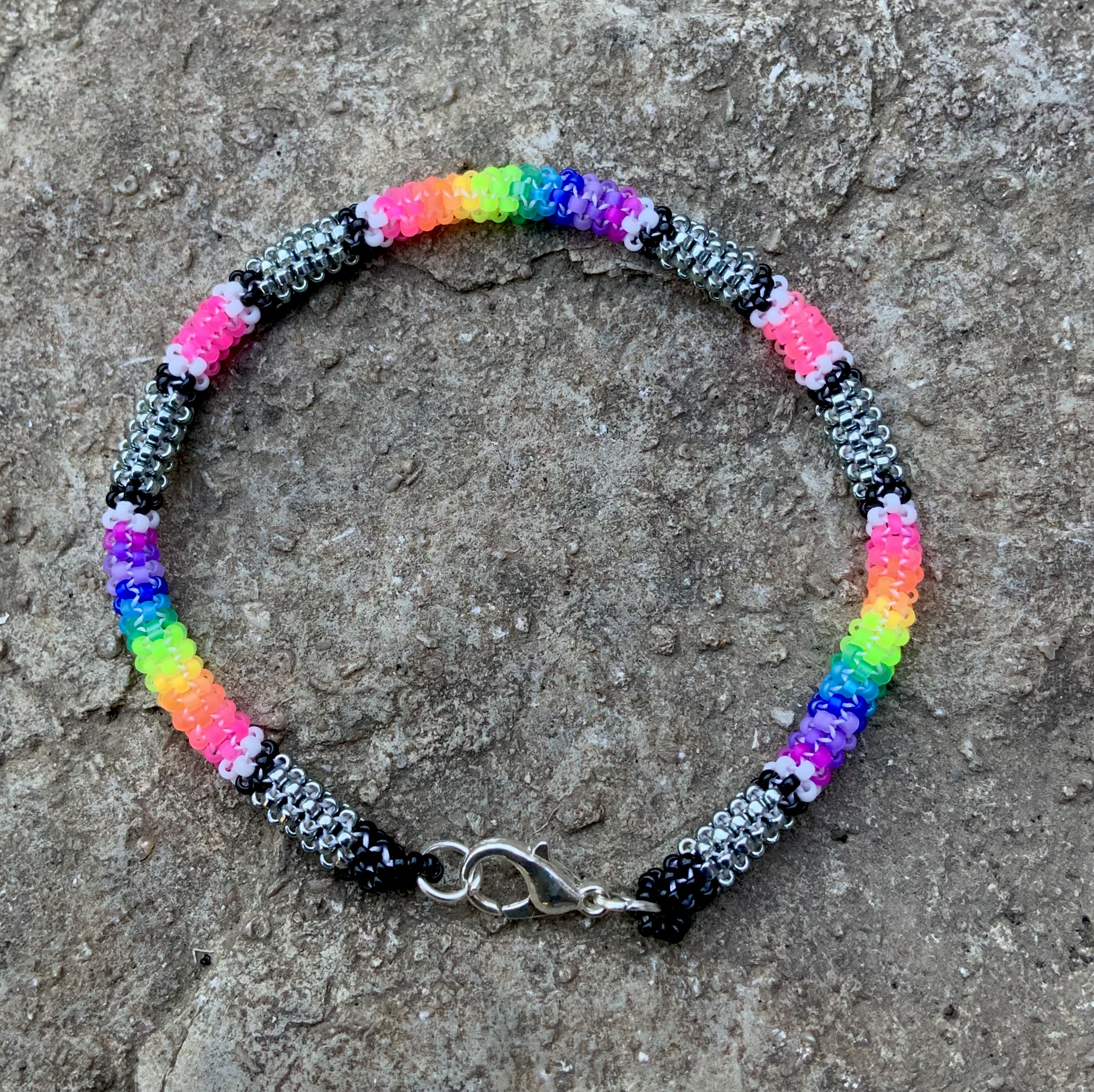 Neon rainbows on steel posts gourd stitched bracelet
