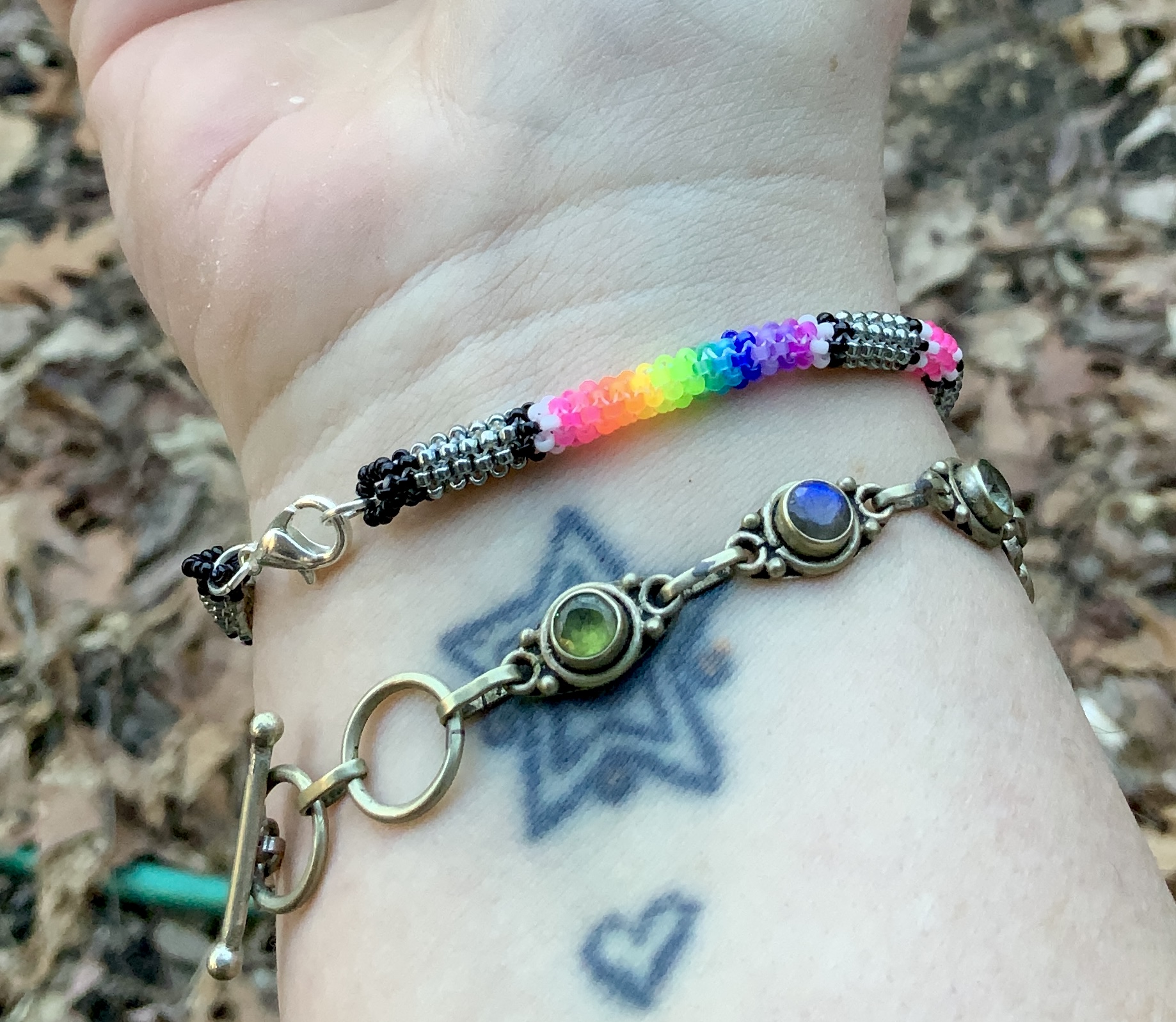 Neon rainbows on steel posts gourd stitched bracelet