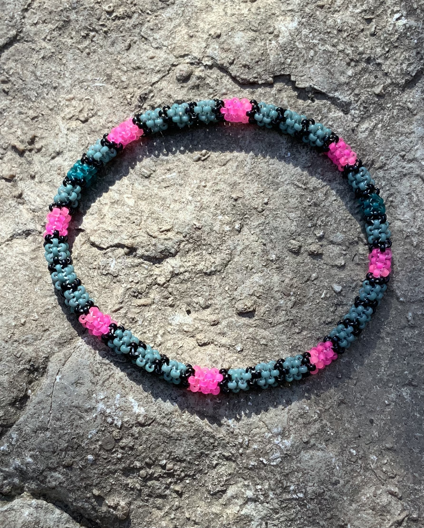 Sage and neon pink gourd stitched bracelet 