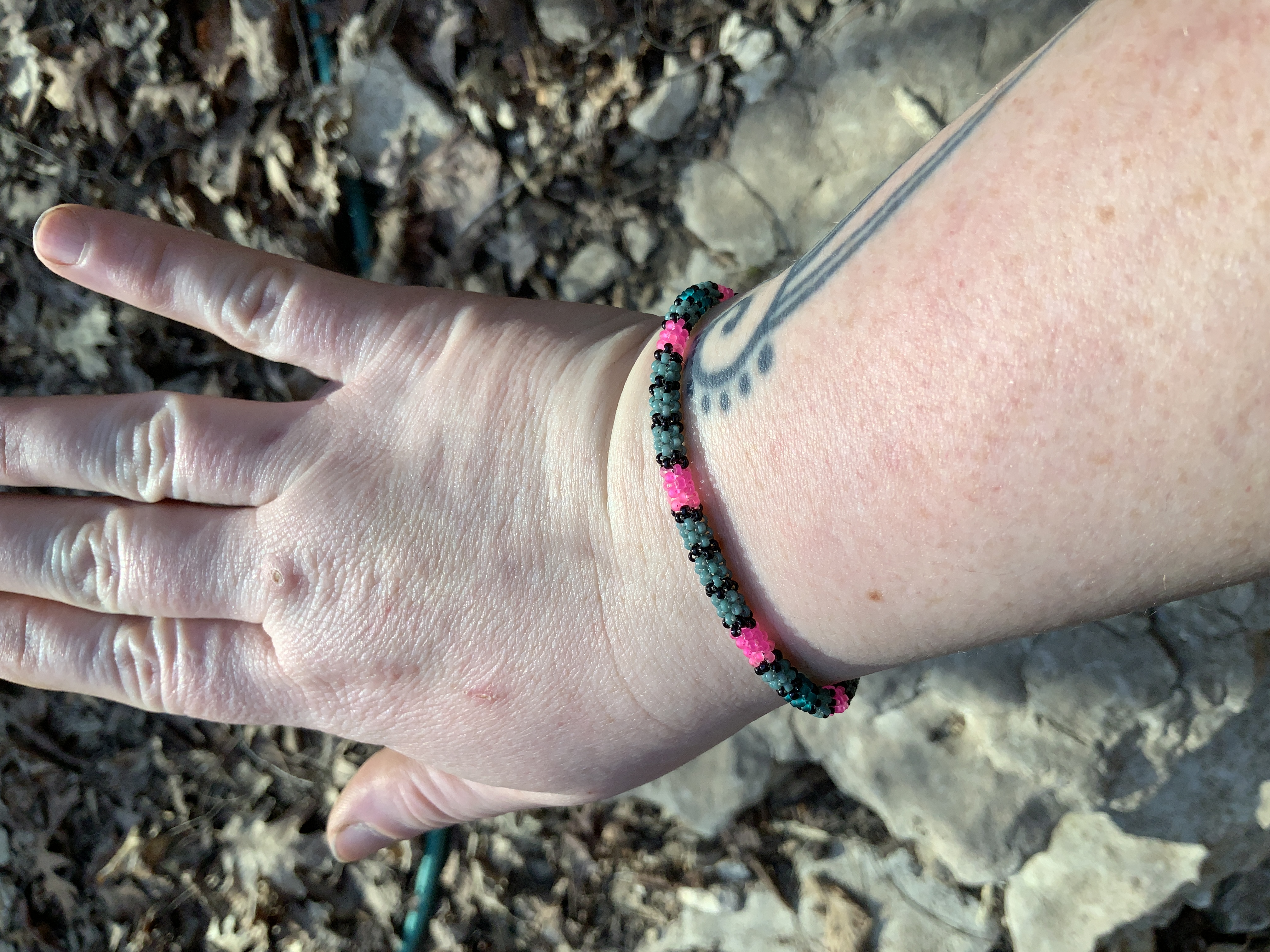 Sage and neon pink gourd stitched bracelet 