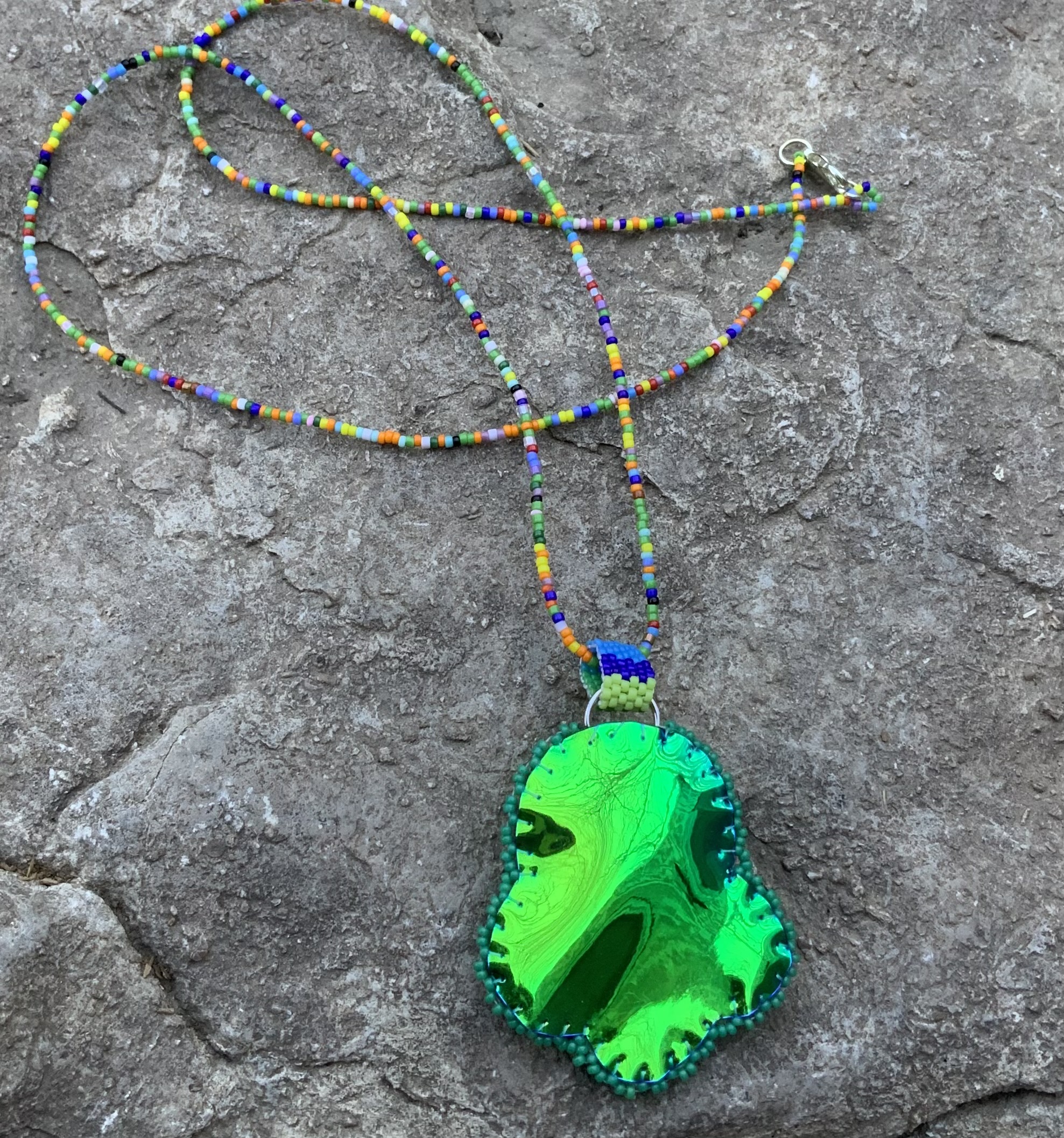 Valley pond beaded rocket ship pendant 