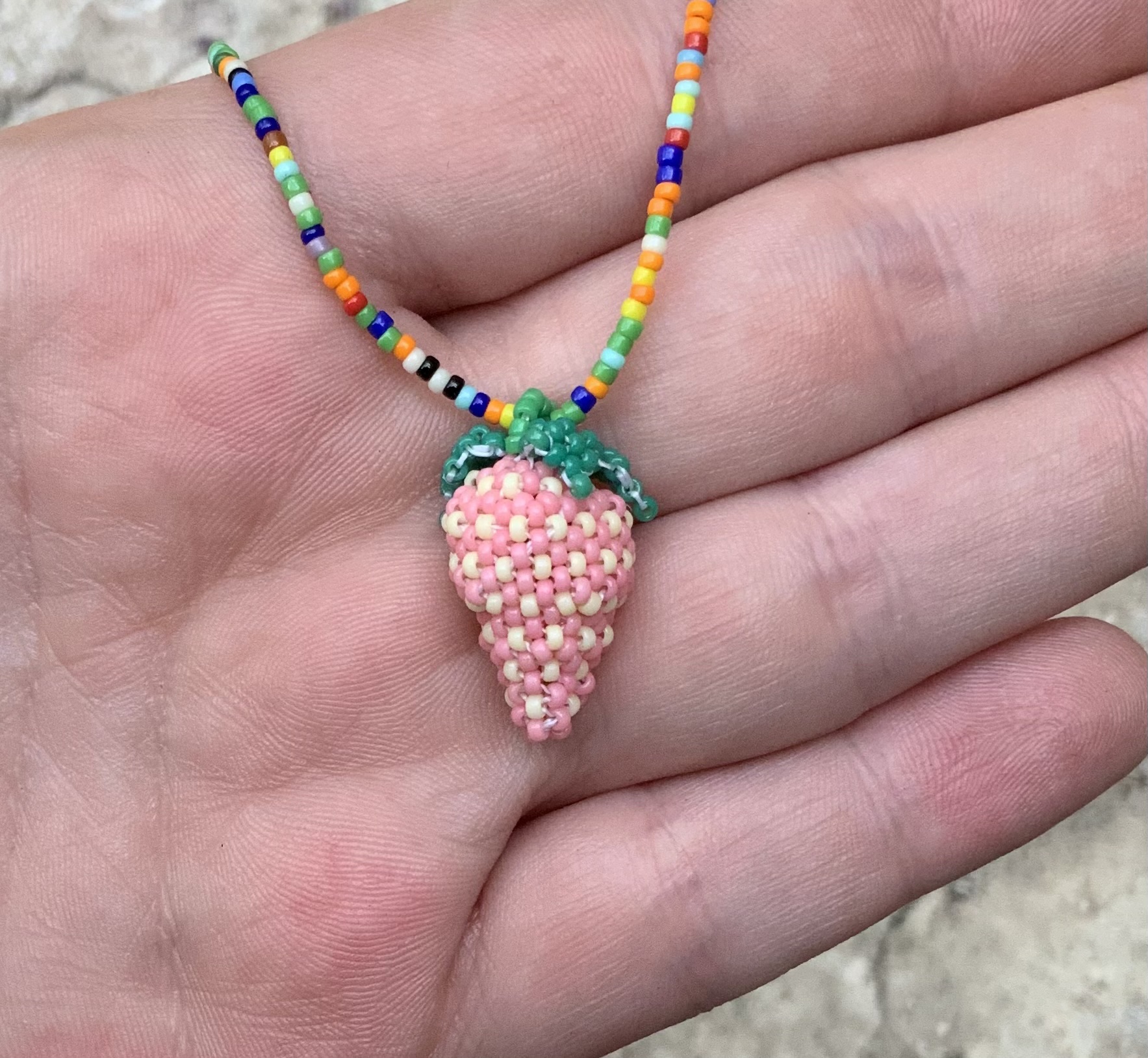 Pink beaded strawberry pendant
